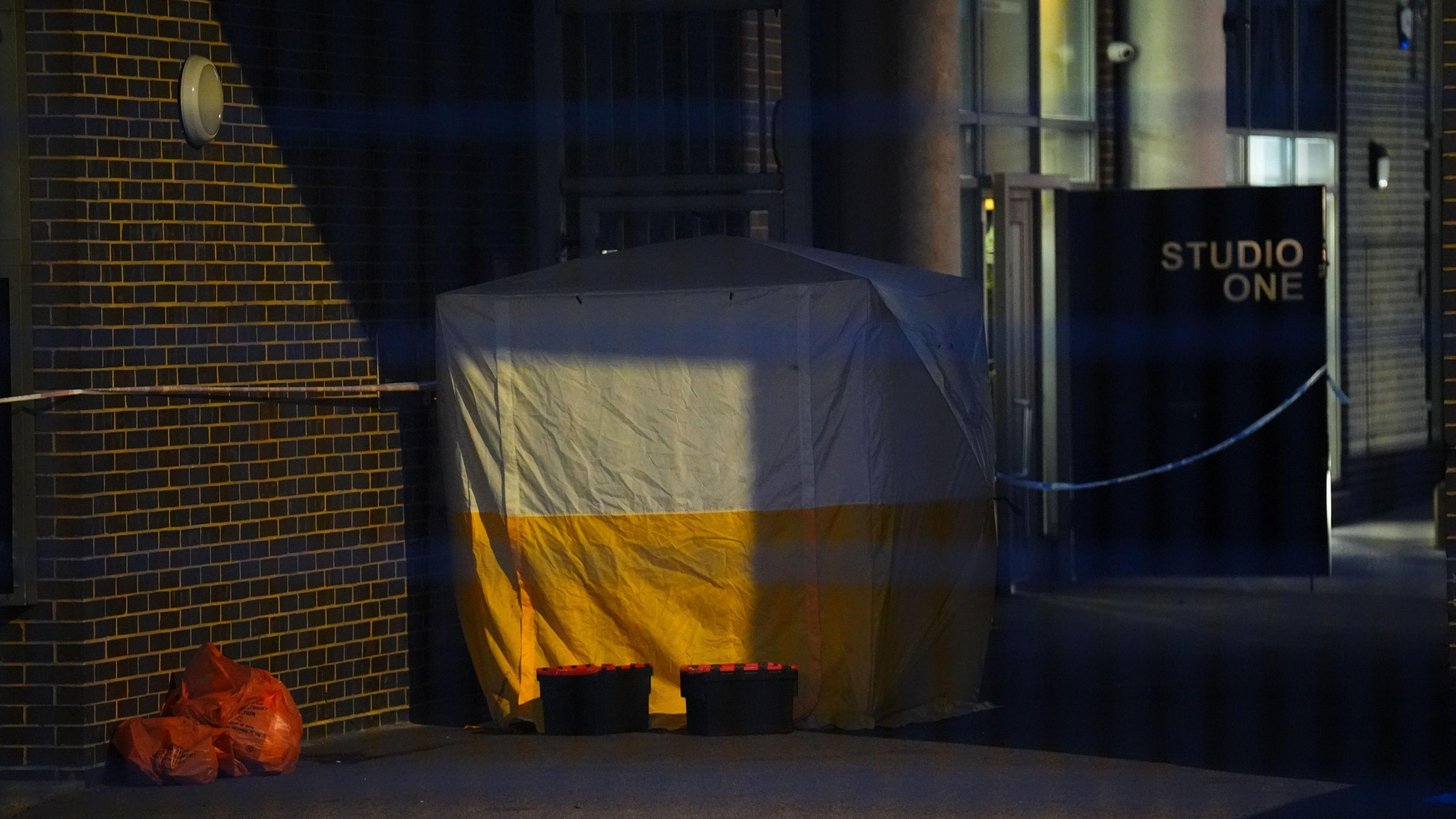 A yellow and white tent