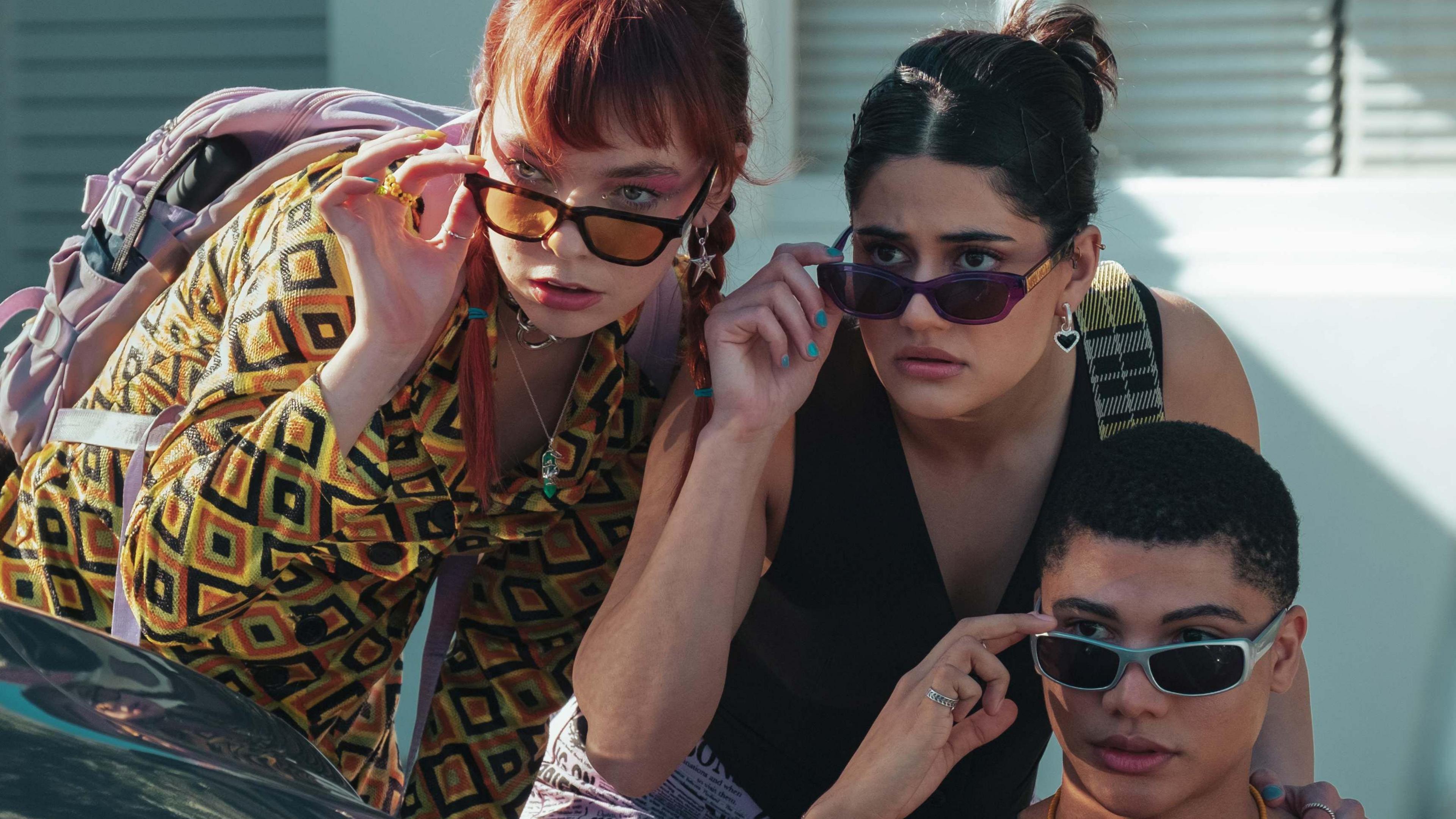 Chloe Hayden, Ayesha Madon and James Majoos pose wearing sunglasses in Australian high school drama Heartbreak High