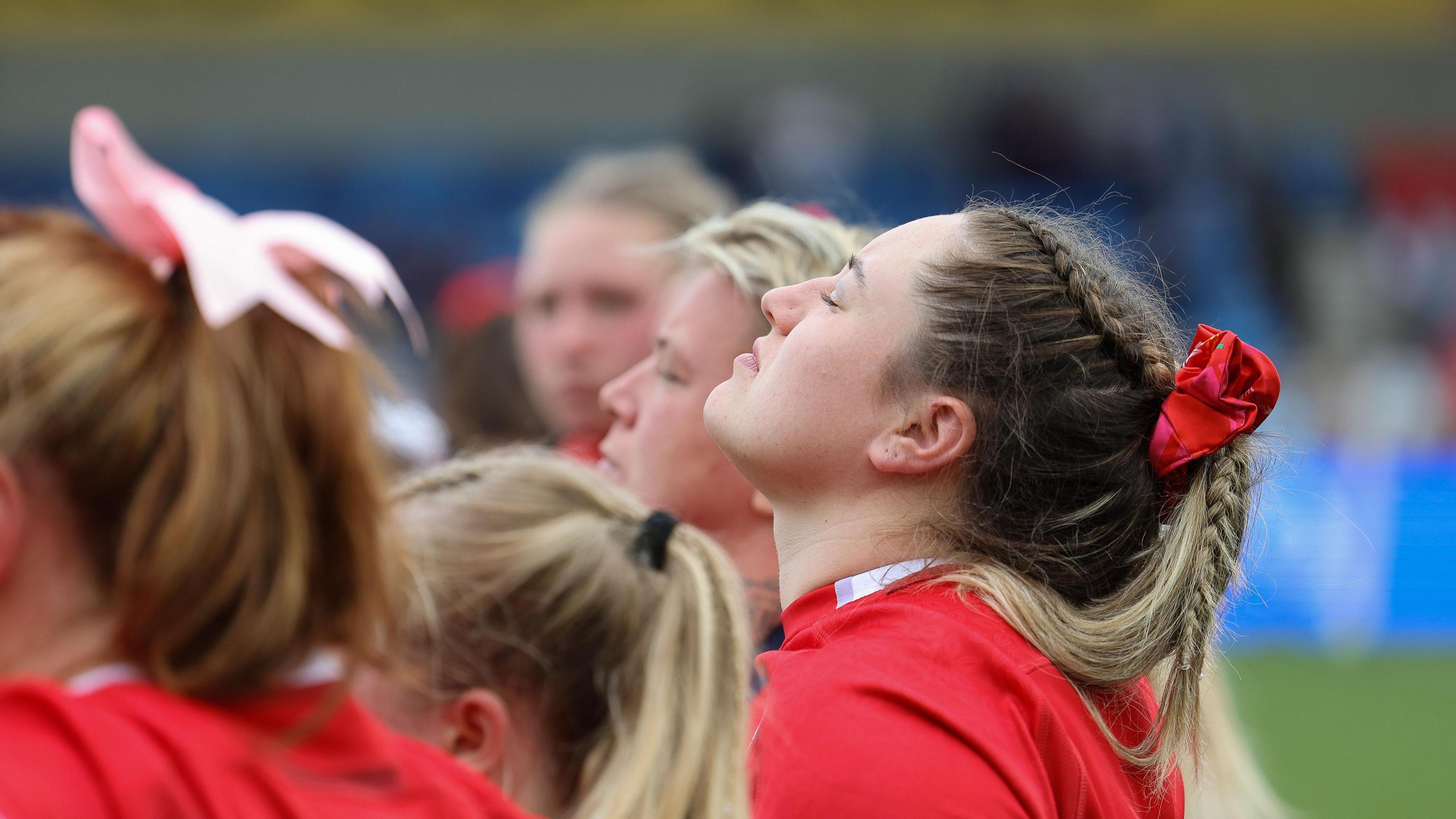 Gwen Crabb looks up in a team huddle