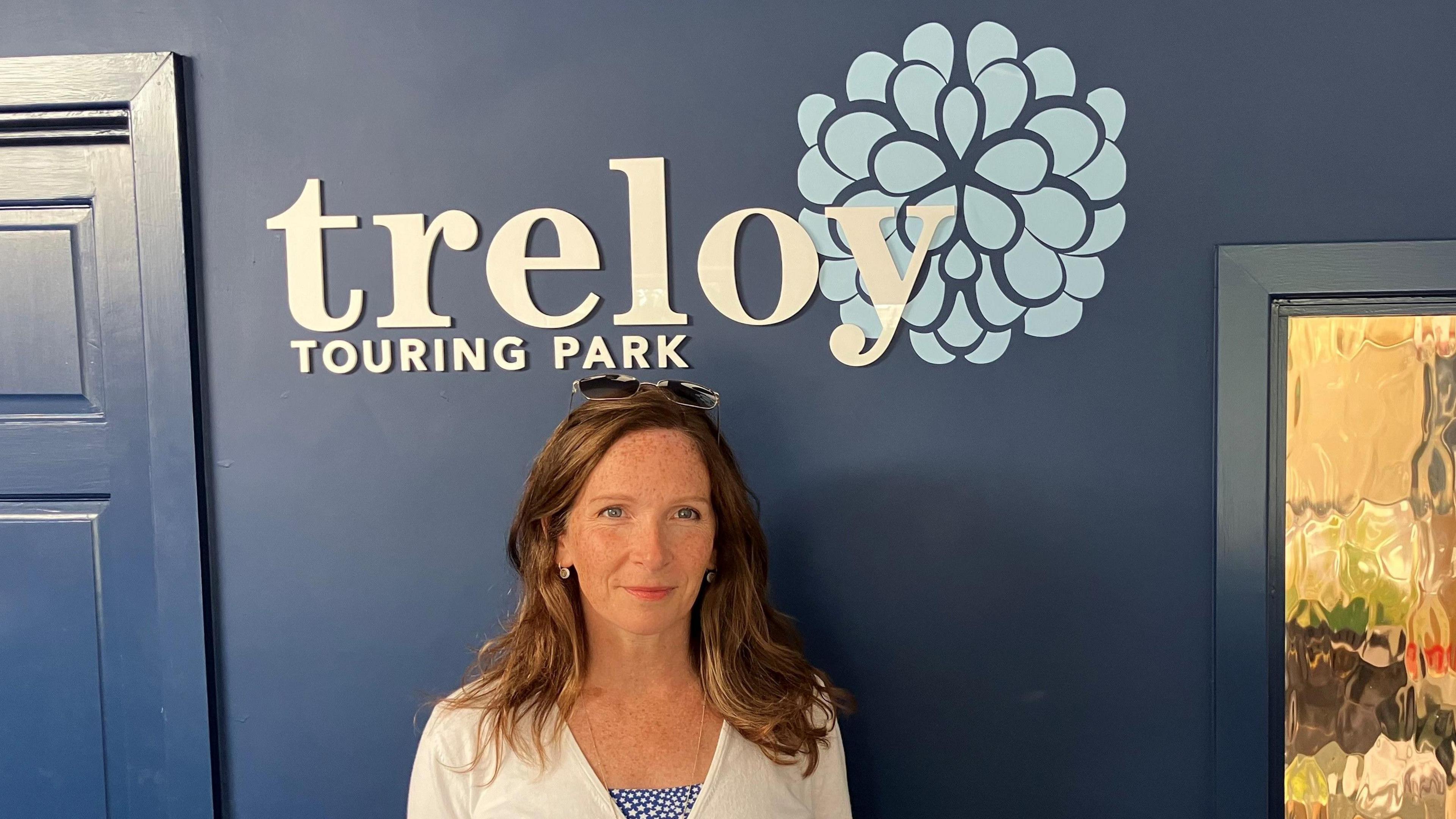 Abby Paul stood in front of a Treloy Touring Park sign.