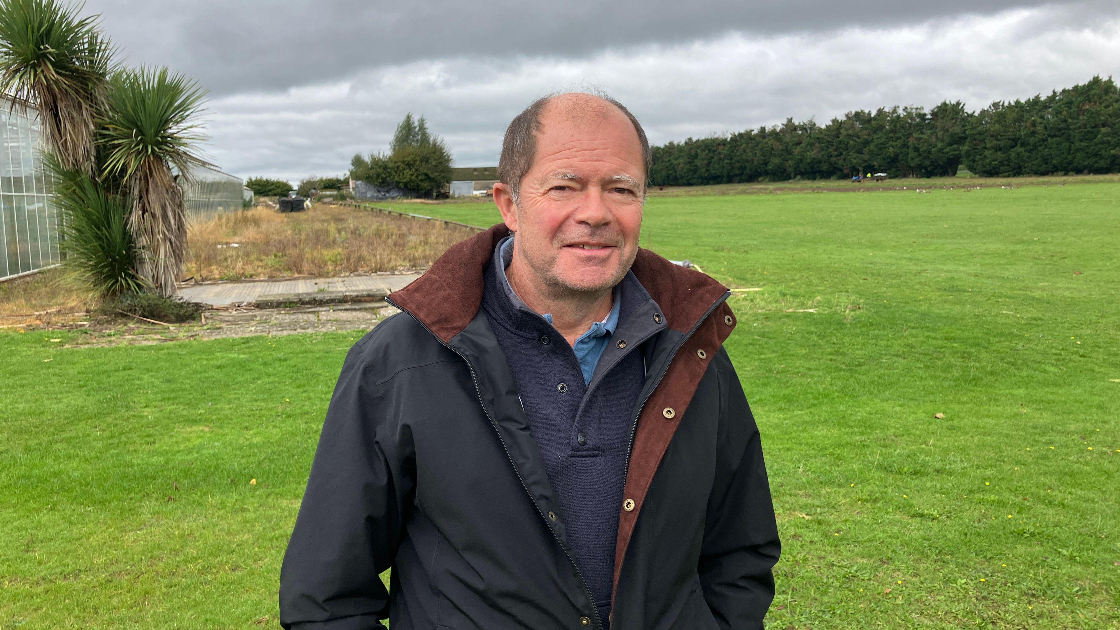 The chair of the Surrey Campaign to Protect Rural England (CPRE), John Goodridge, green space behind Secretts of Milford