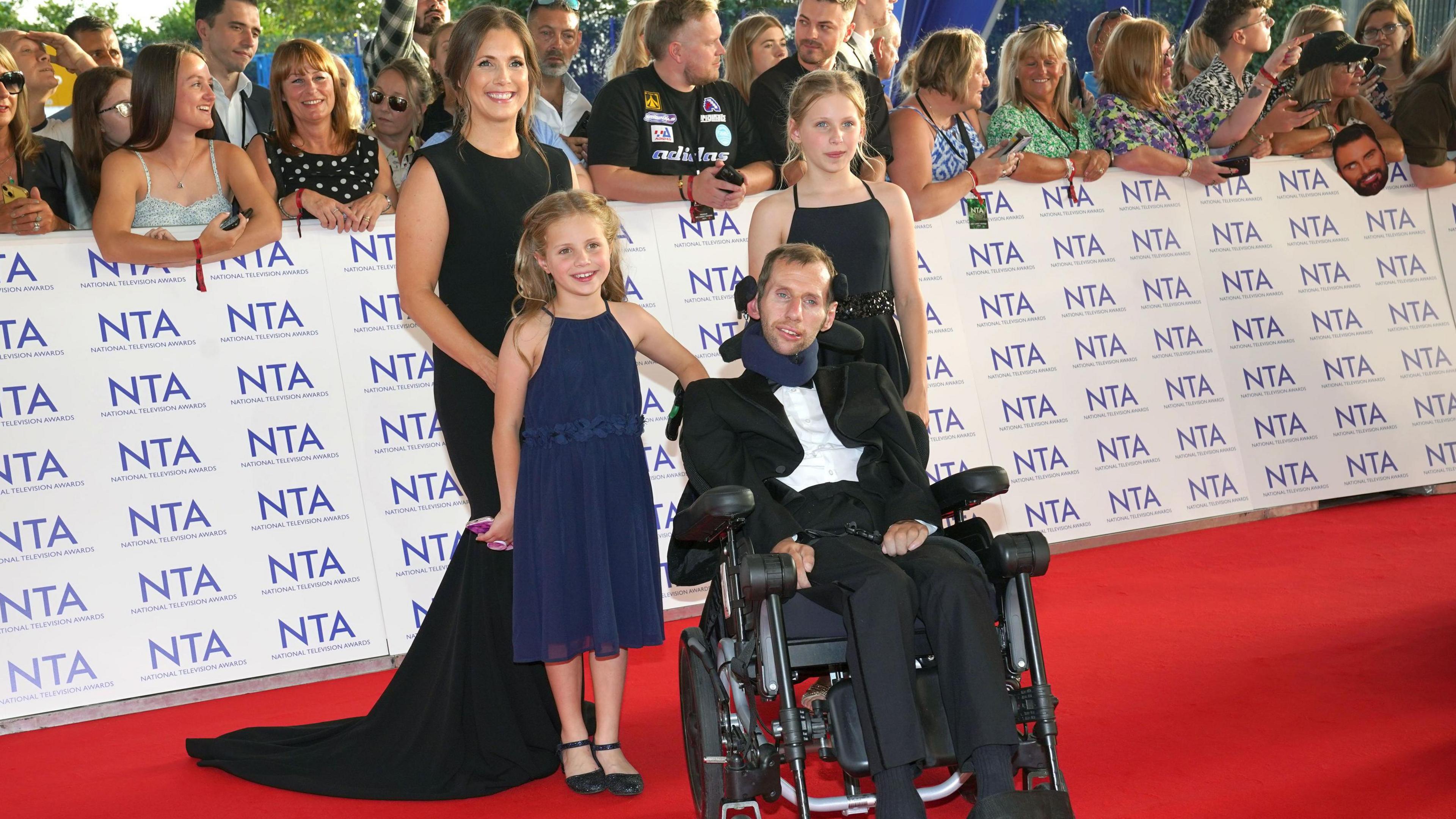 Rob Burrow pictured with his wife and his two daughters on the red carpet of an awards show