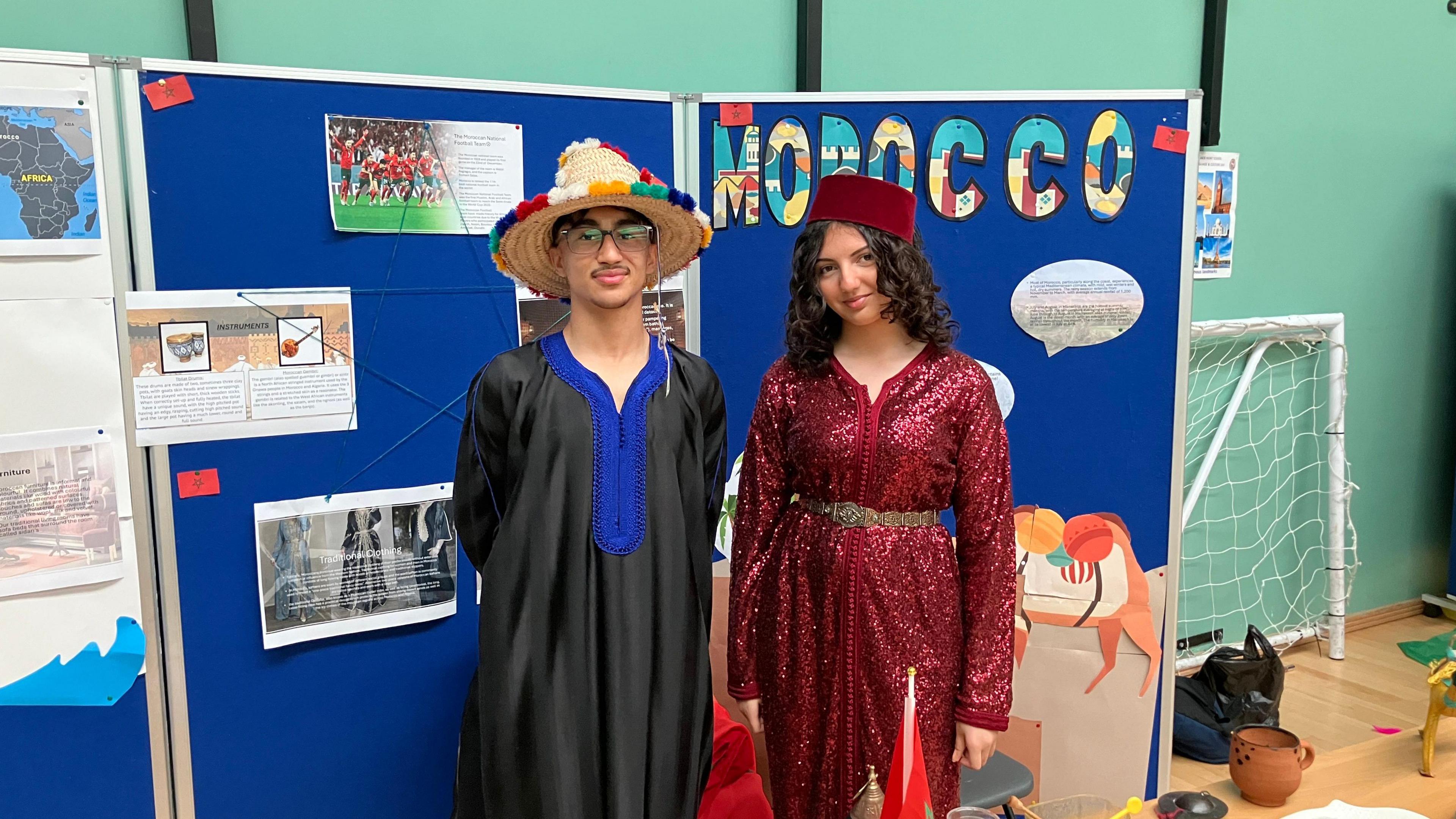 Areen and Wasila dressed in kaftans and wearing traditional head gear from Morocco