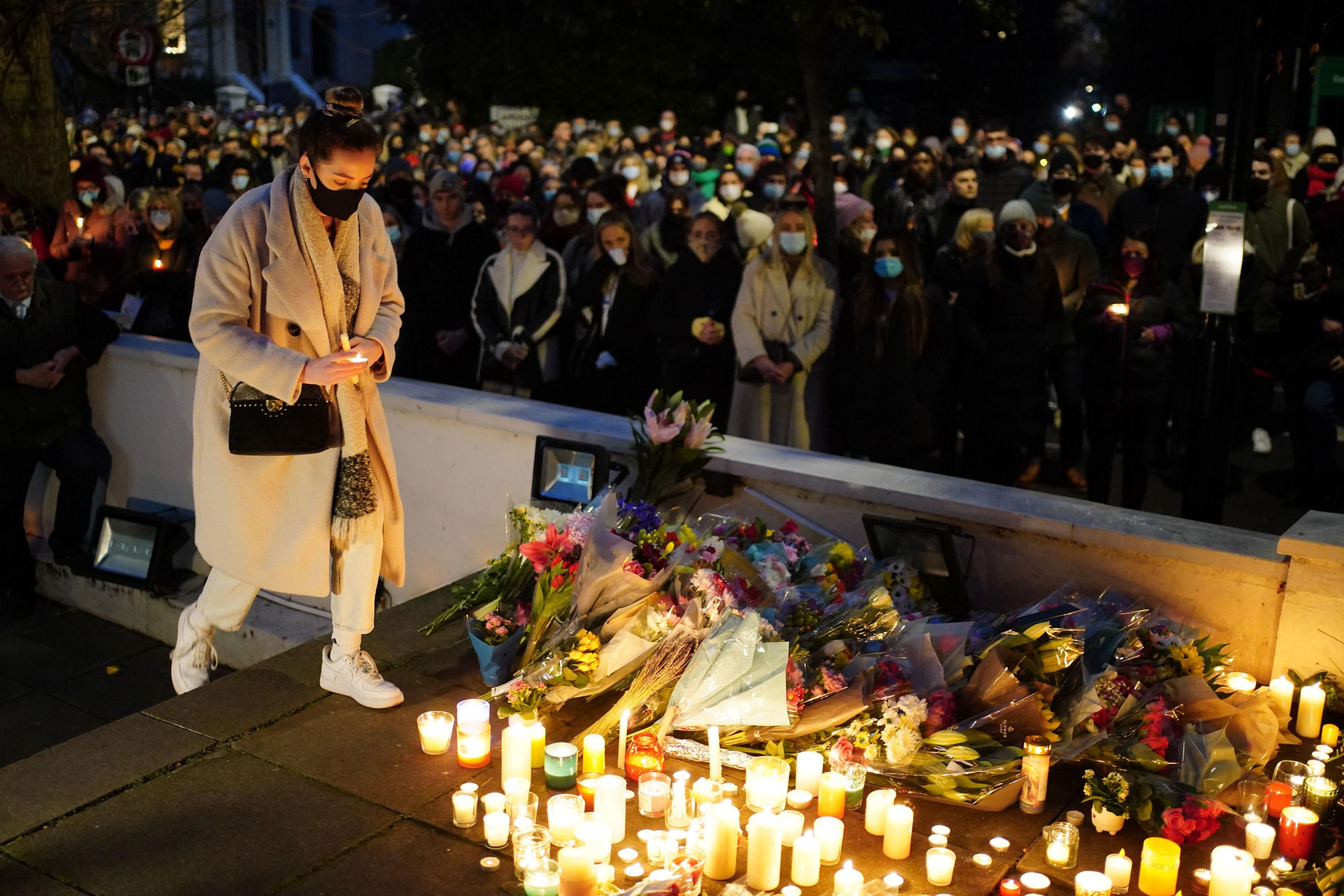 Floral tributes and candles are left during a vigil outside the London Irish Centre in Camden in memory of Ashling Murphy