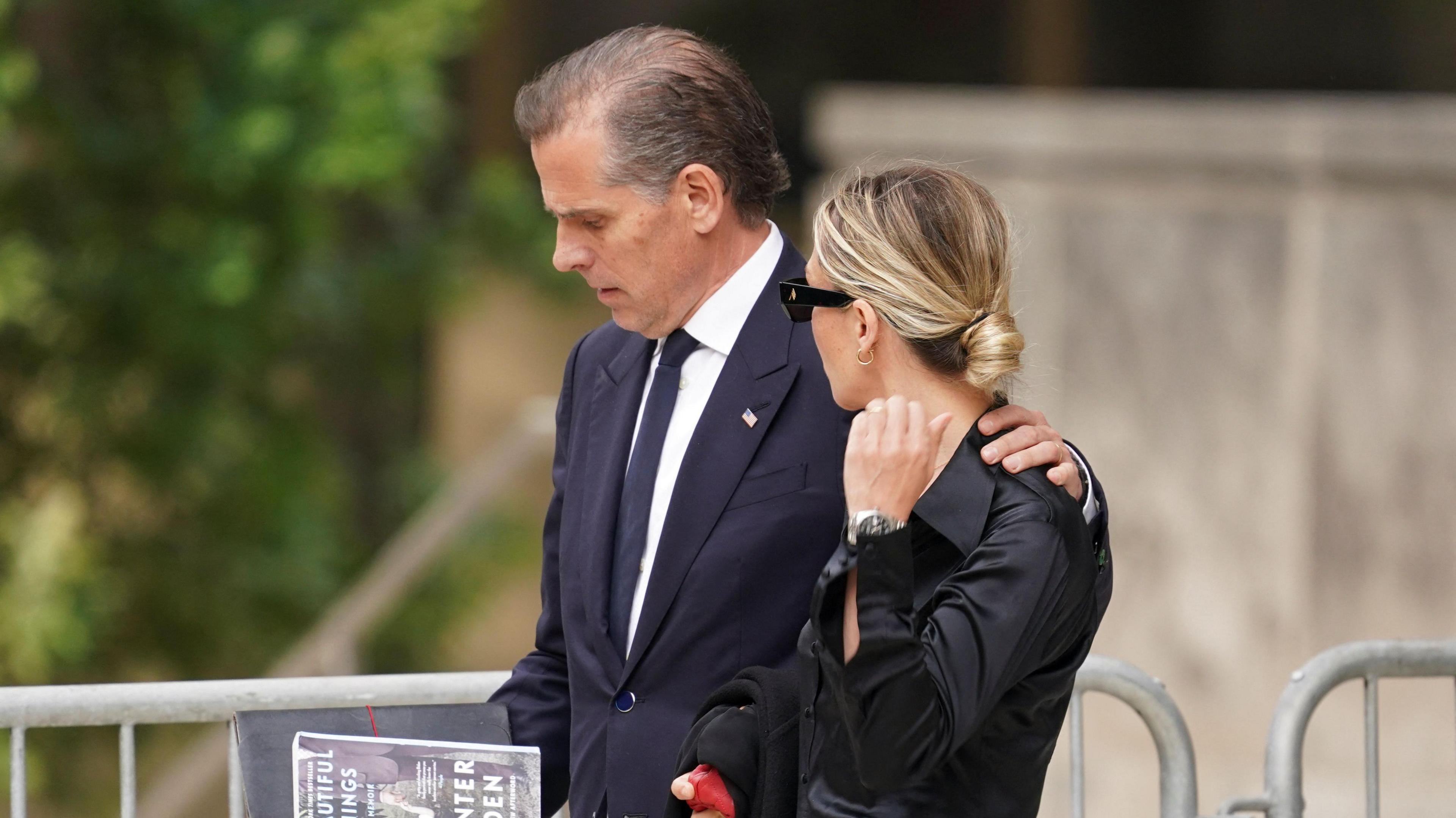 Hunter Biden seen win his wife Melissa Cohen Biden holding his memoir Beautiful Things 