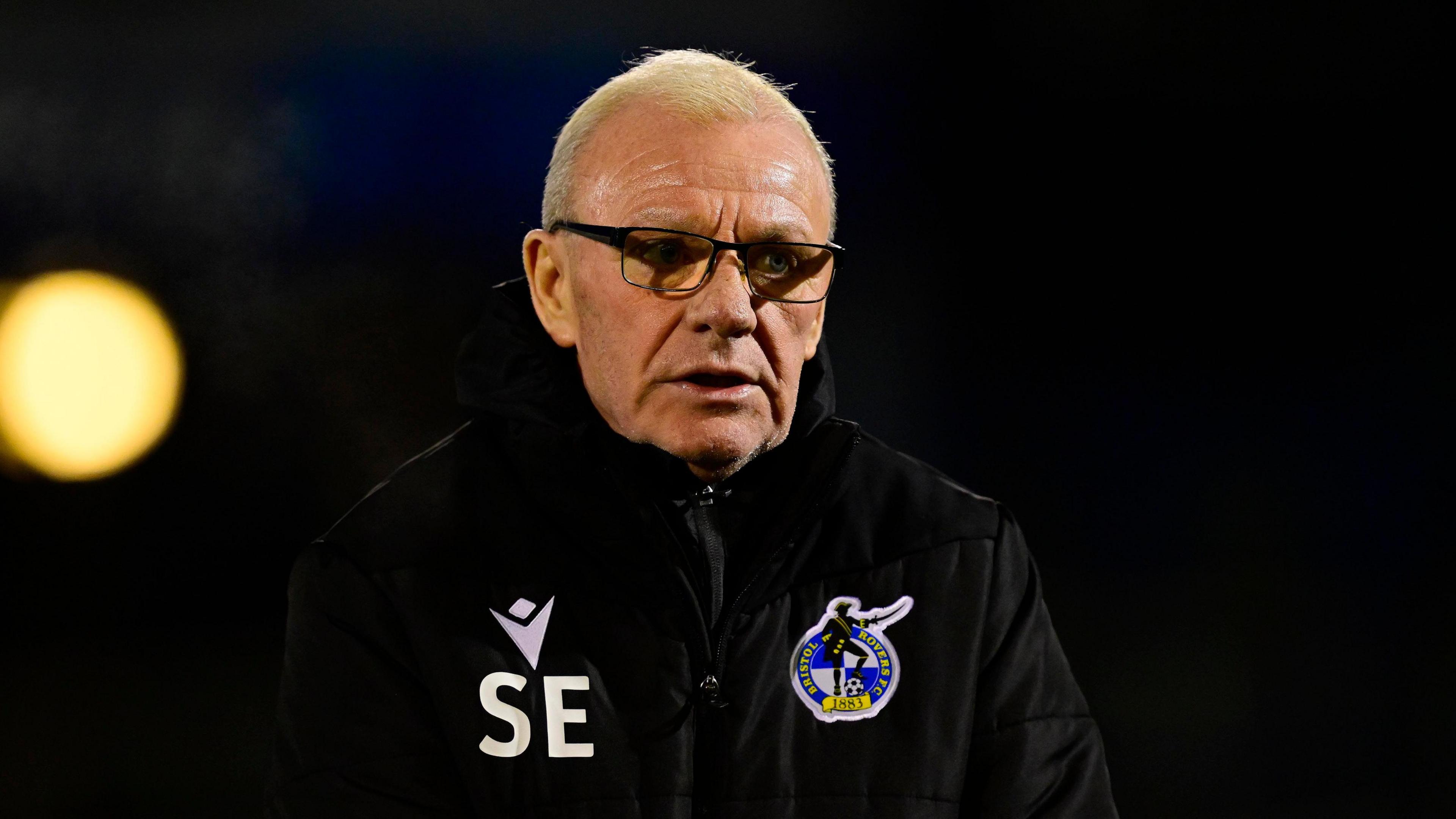 Steve Evans walking during Bristol Rovers' 4-3 defeat by Plymouth