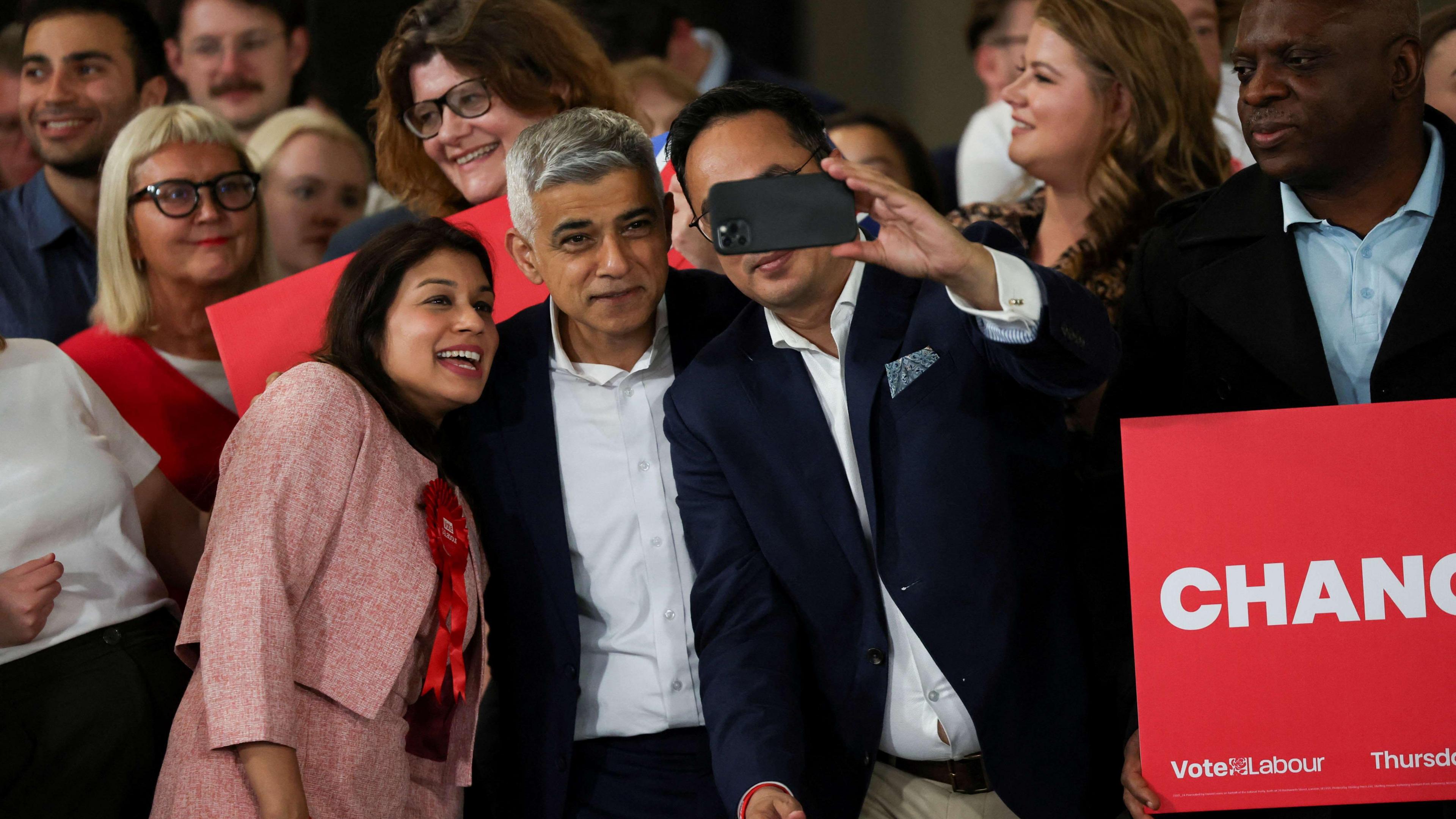 Sadiq Khan poses for a selfie at a watch party for the results of the election