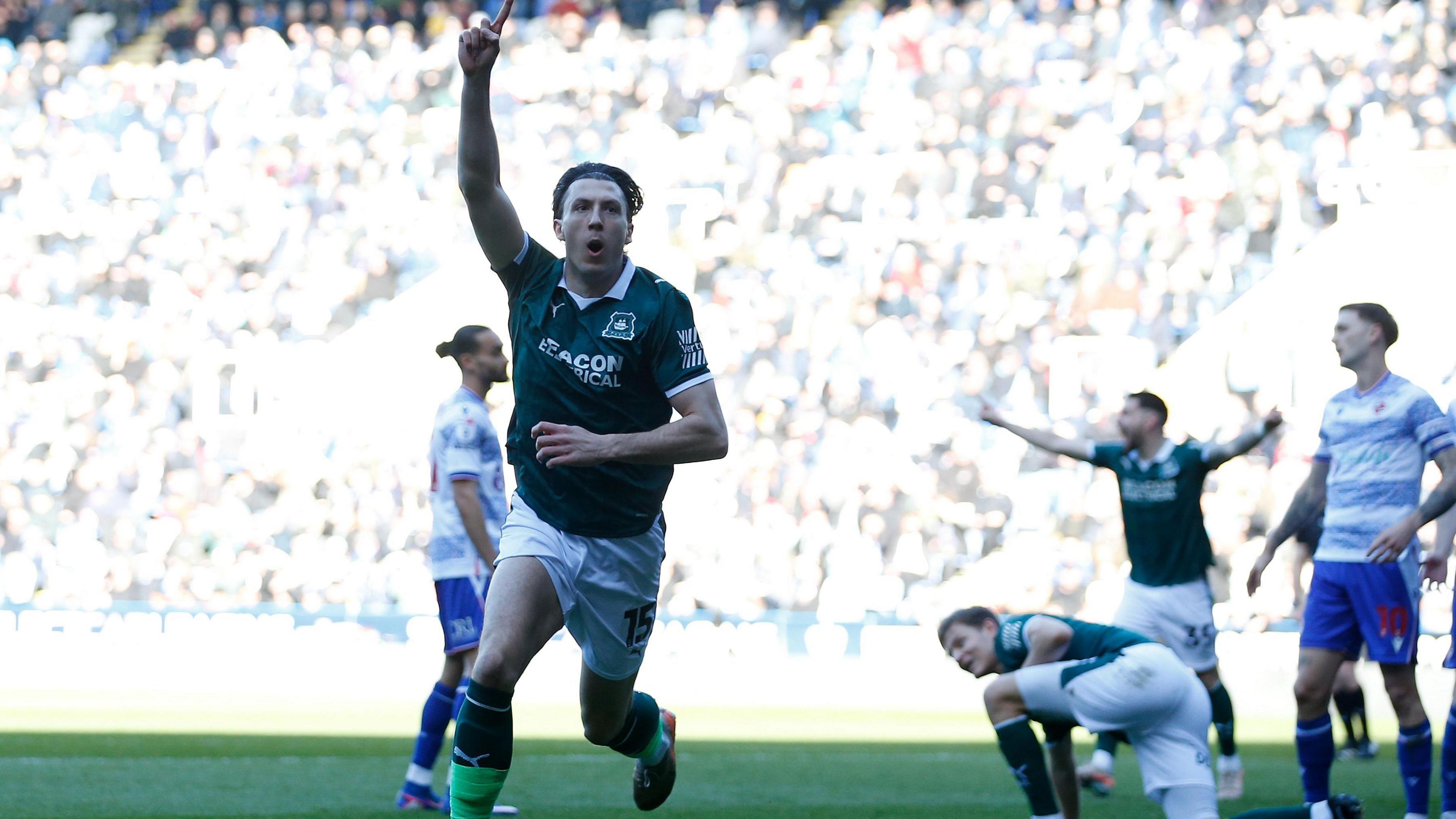 Alex Mitchell celebrates scoring for Plymouth at Reading
