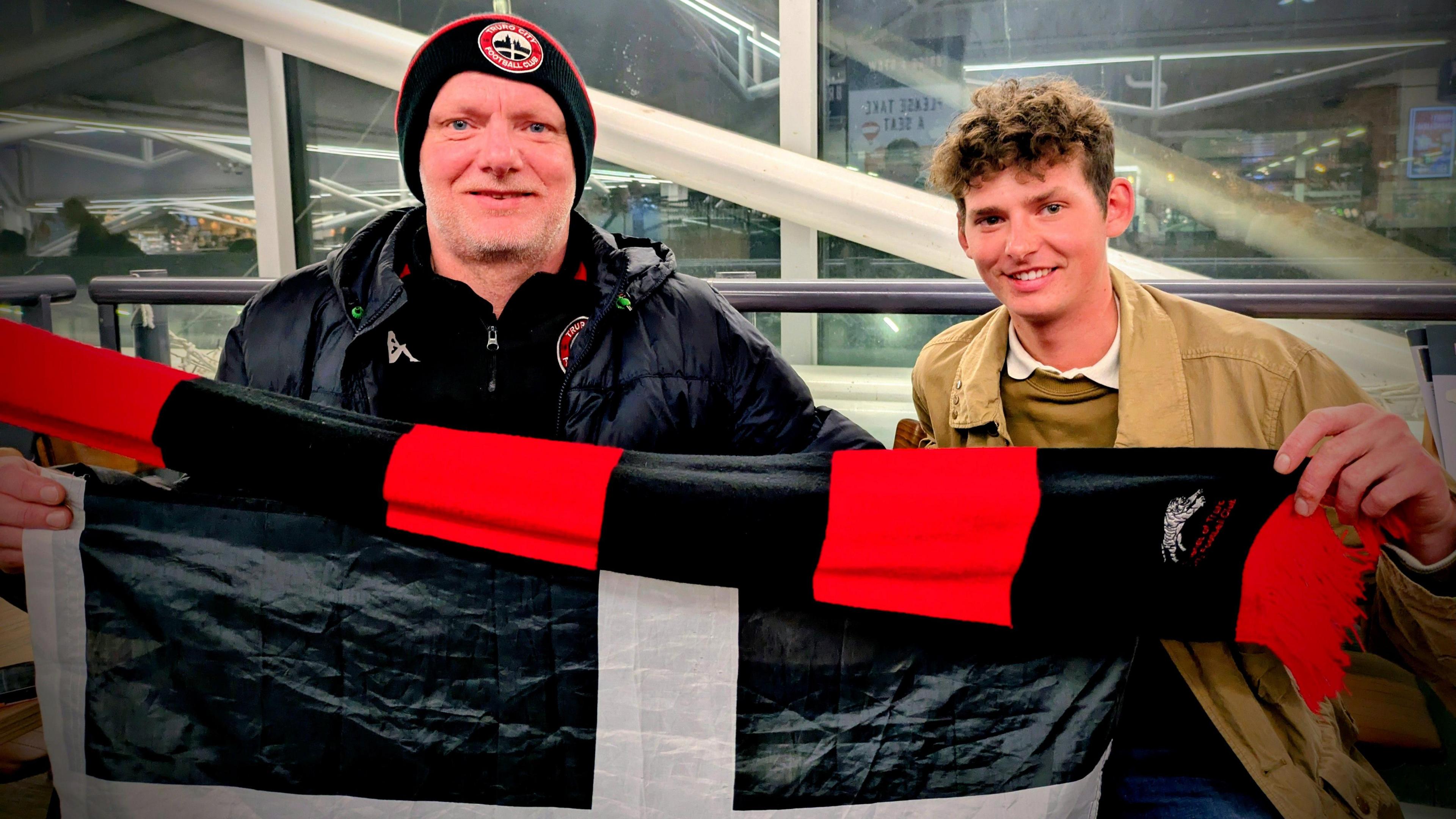 A photo of Truro City fans Tom and John Joyce on their way to Gateshead