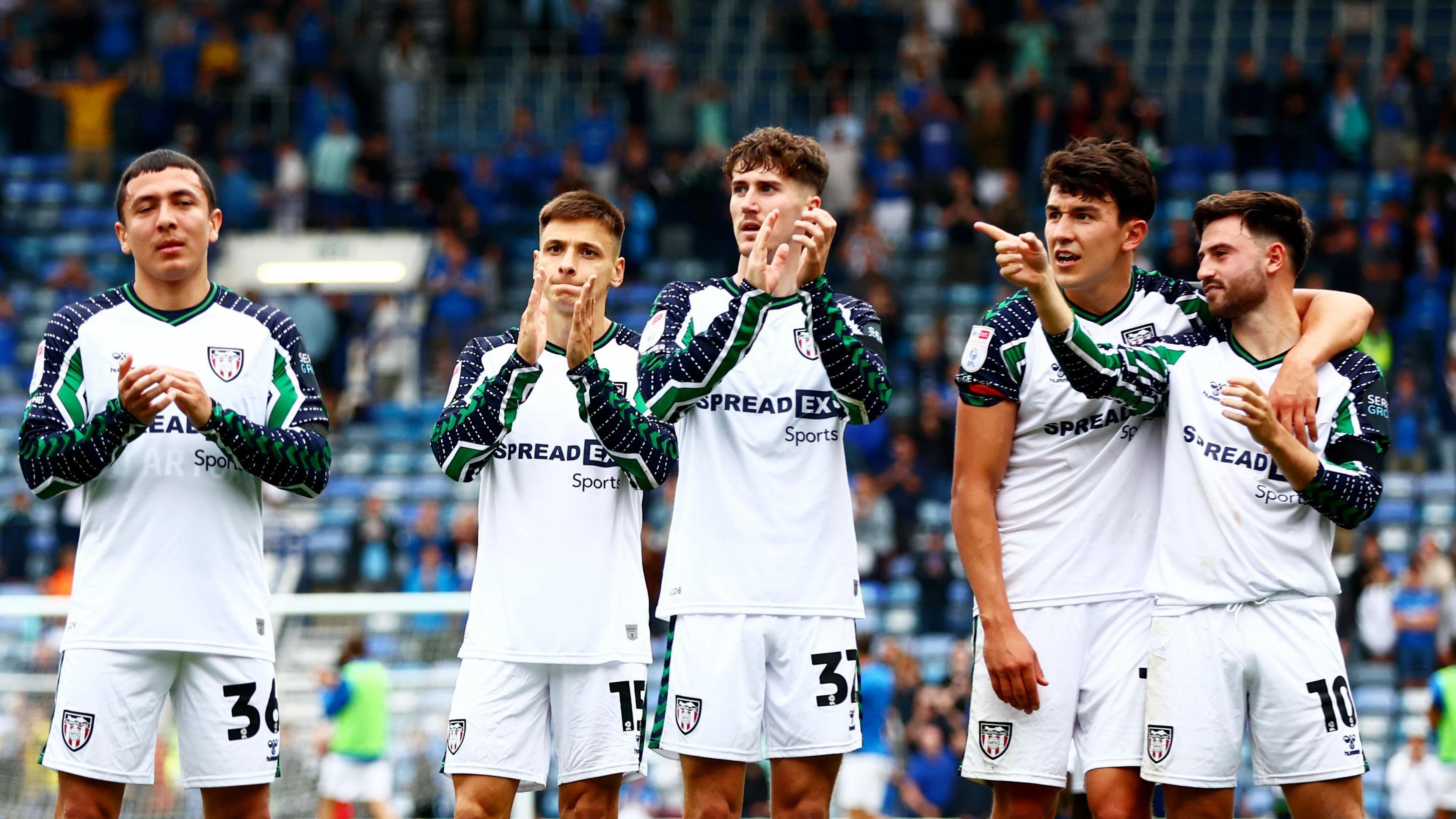 Sunderland players clap their fans after the 3-1 win at Portsmouth