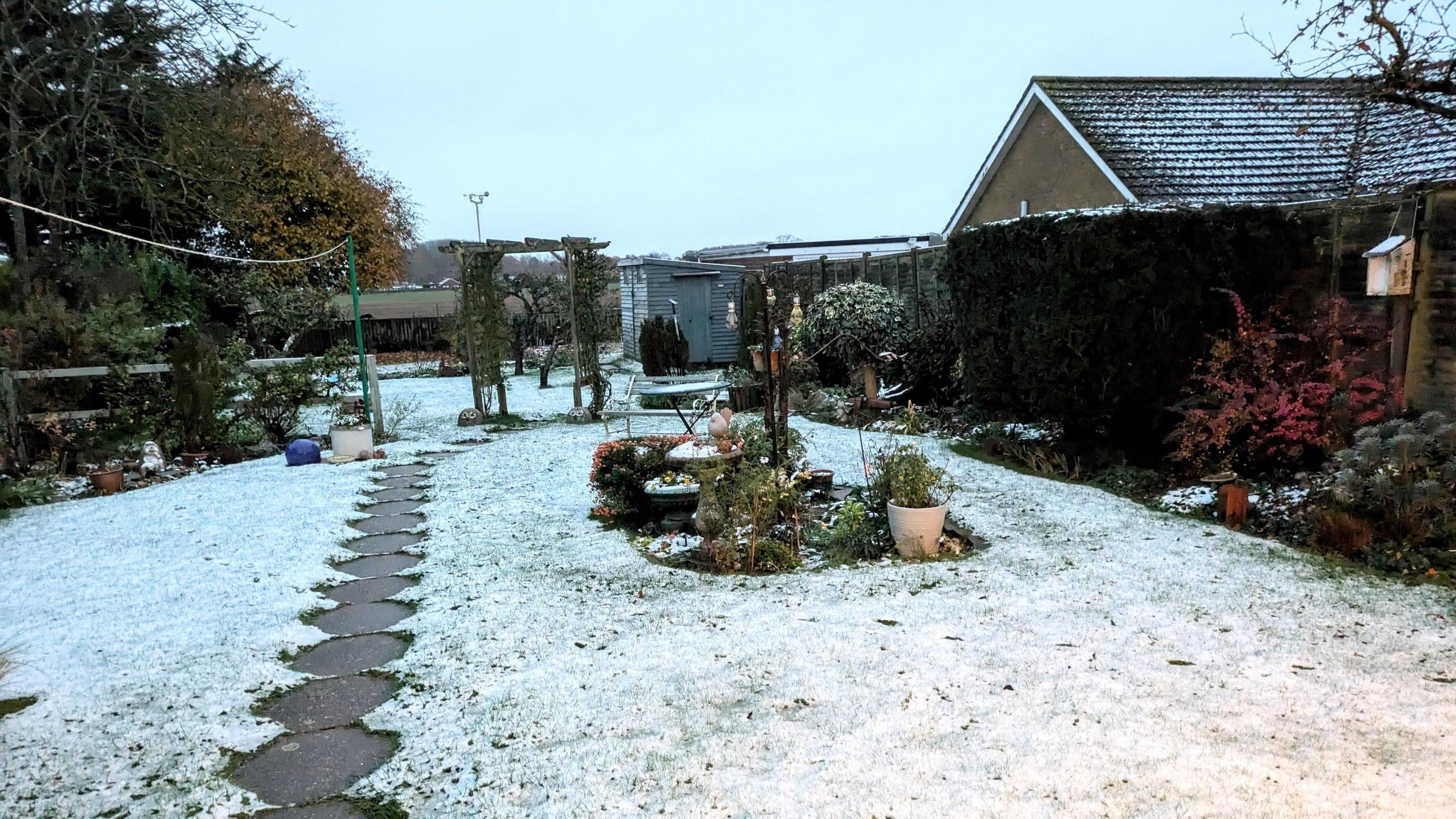 Light covering of snow in a garden