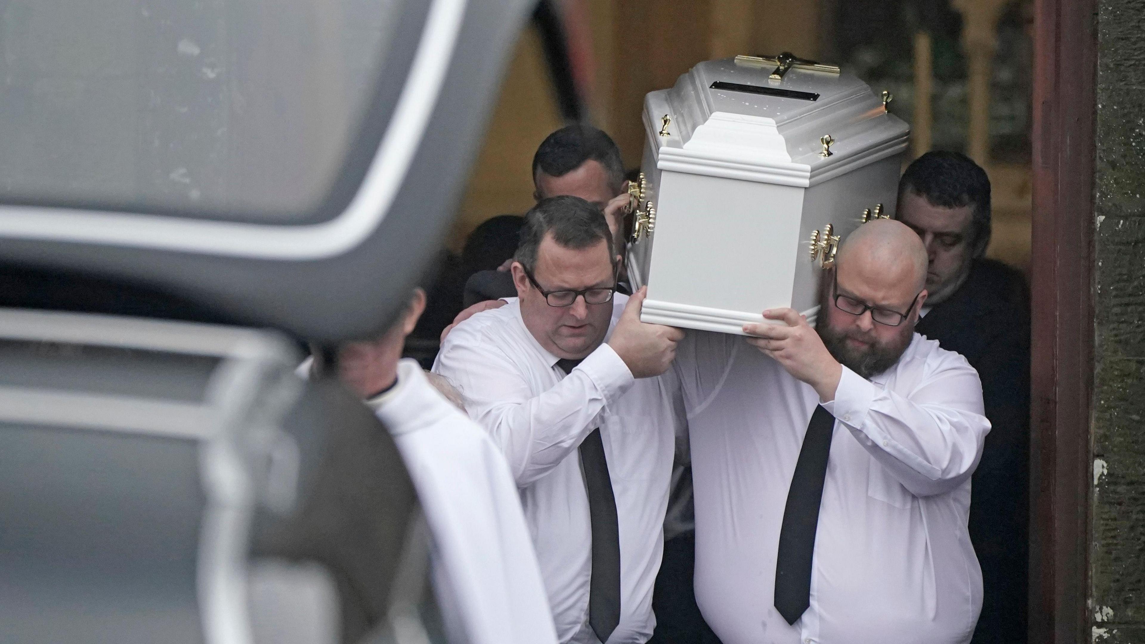 The coffin of Matthew Healy is carried out of the Church of the Immaculate Conception in Cork