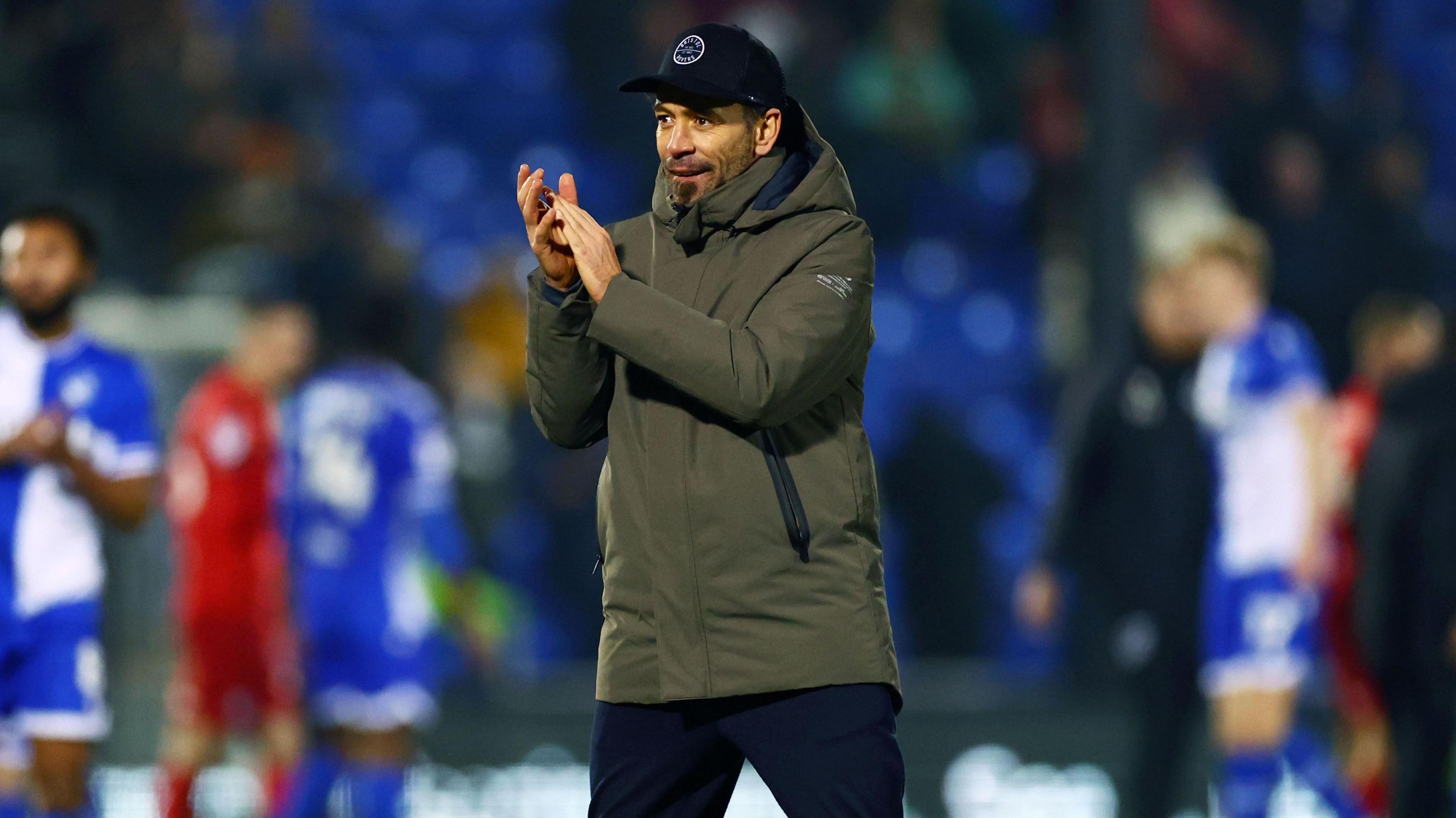 Inigo Calderon on the pitch clapping after the full-time whistle against Barnsley