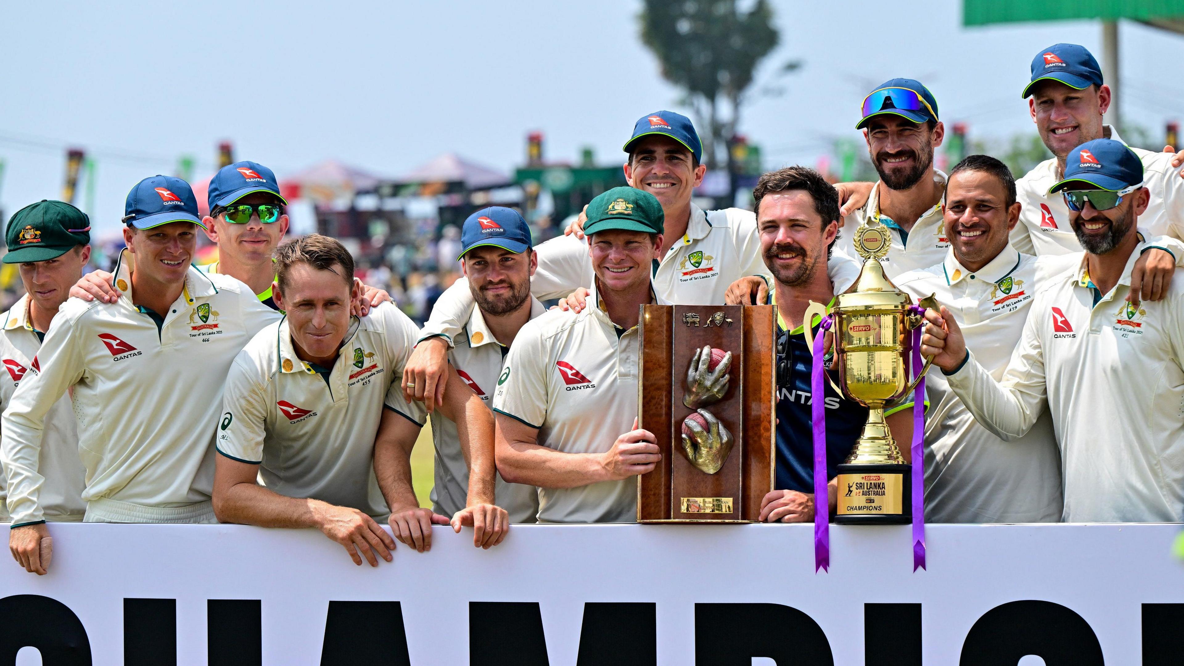 Australia celebrate with the Warne-Muralitharan Trophy