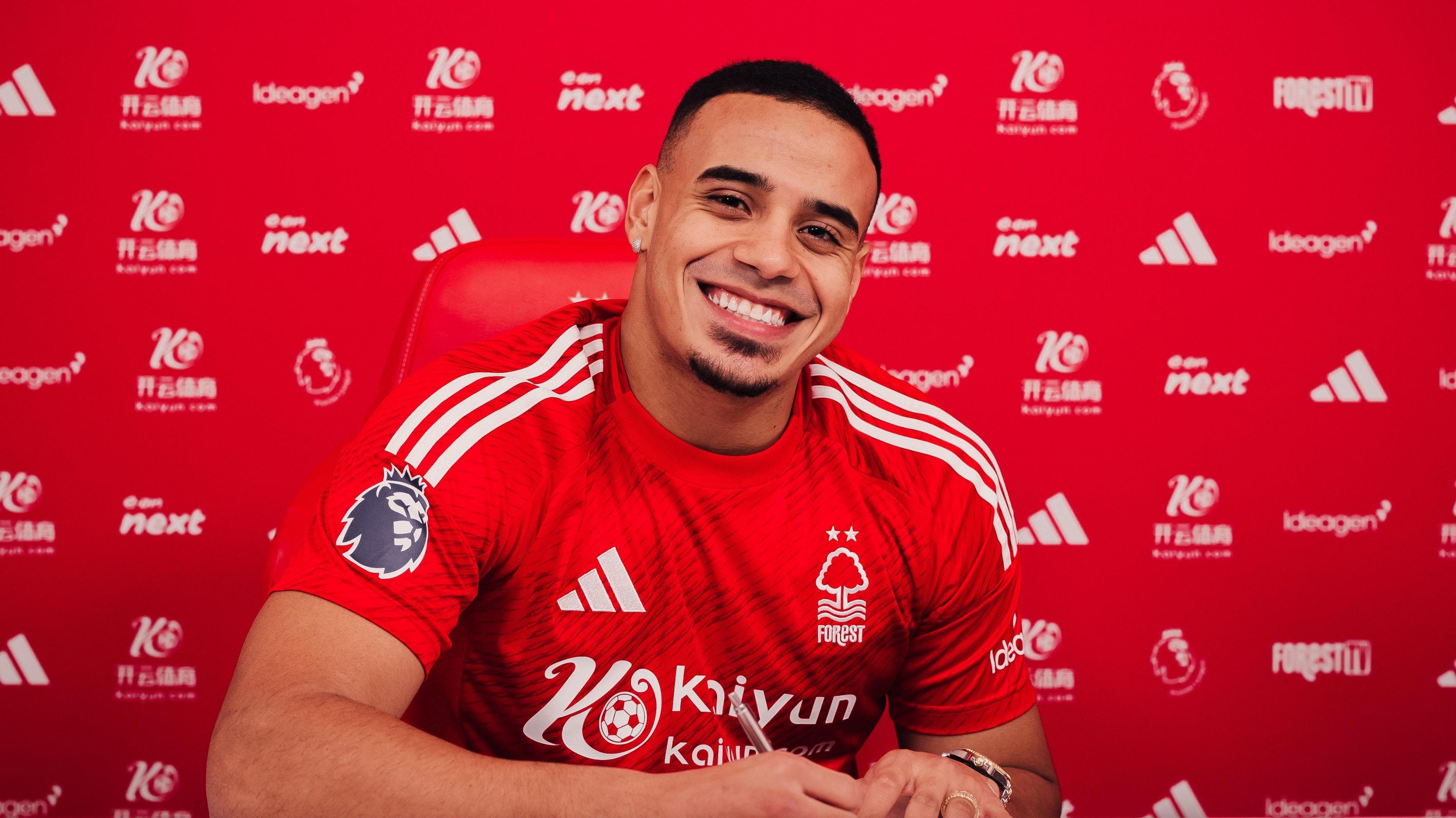 Nottingham Forest defender Murillo smiles as he signs a new contract