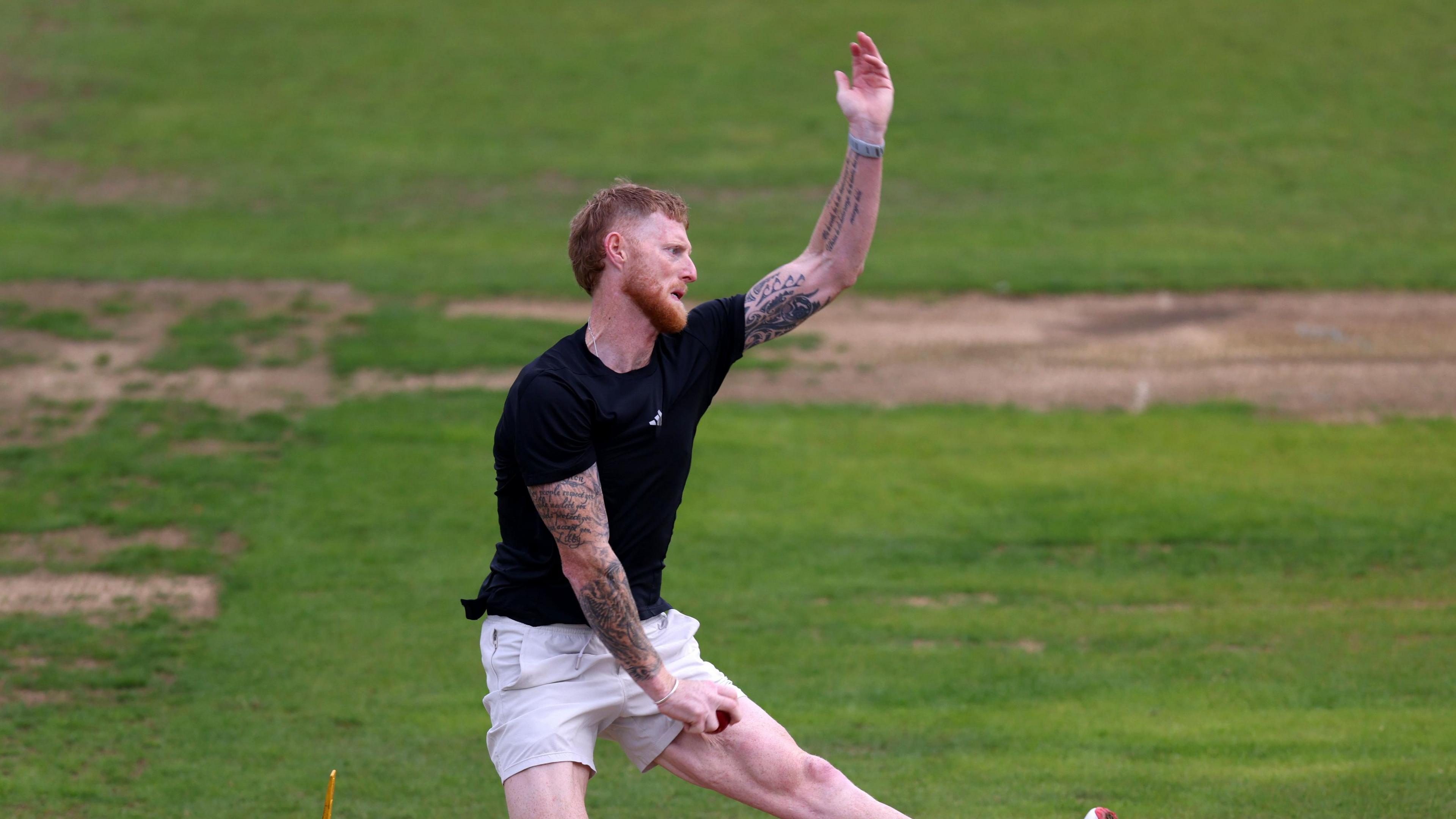 Ben Stokes, wearing a black t-shirt and cream shorts, bowls during the lunch break at Headingley