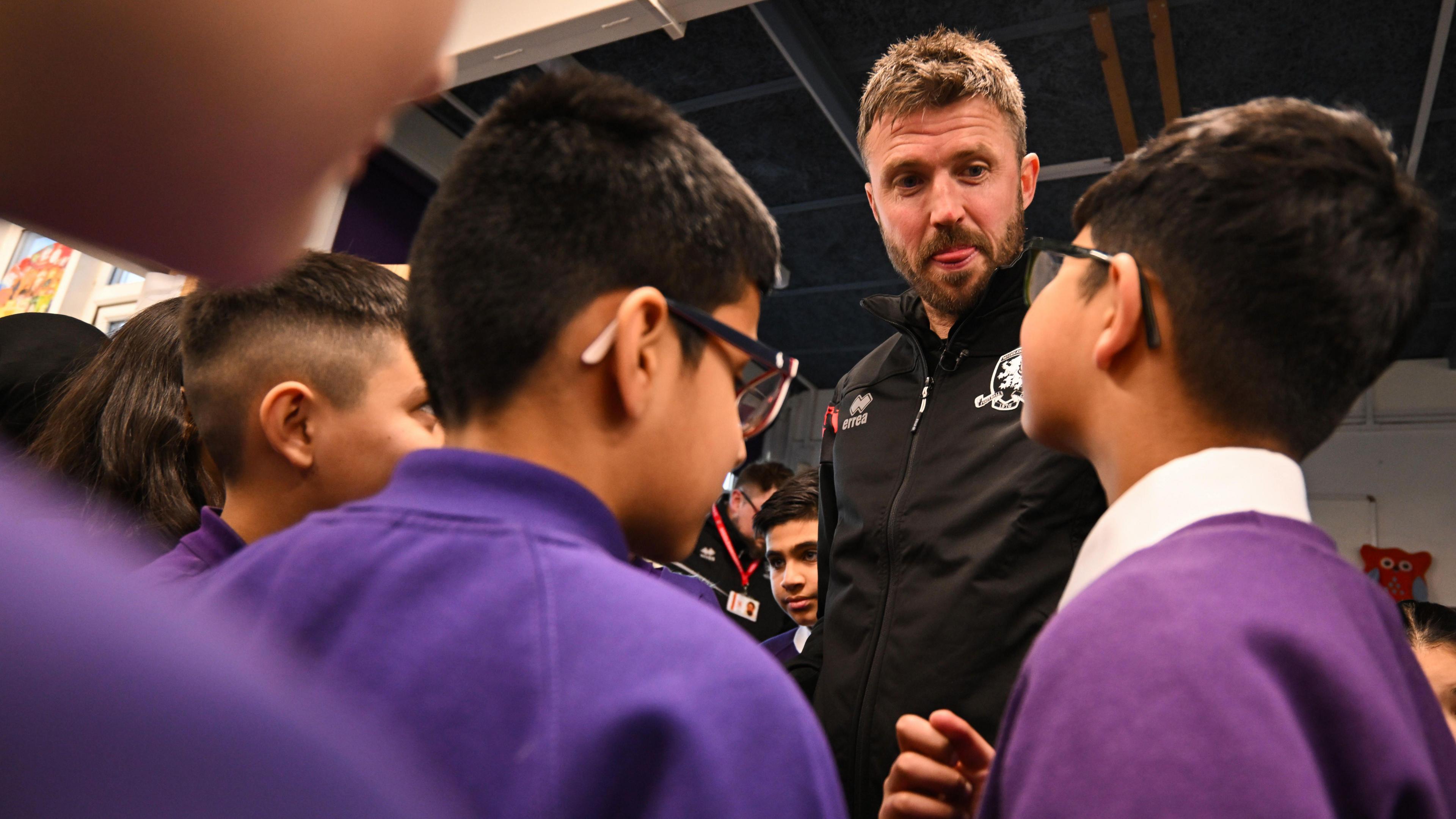 Michael Carrick is quizzed by schoolchildren