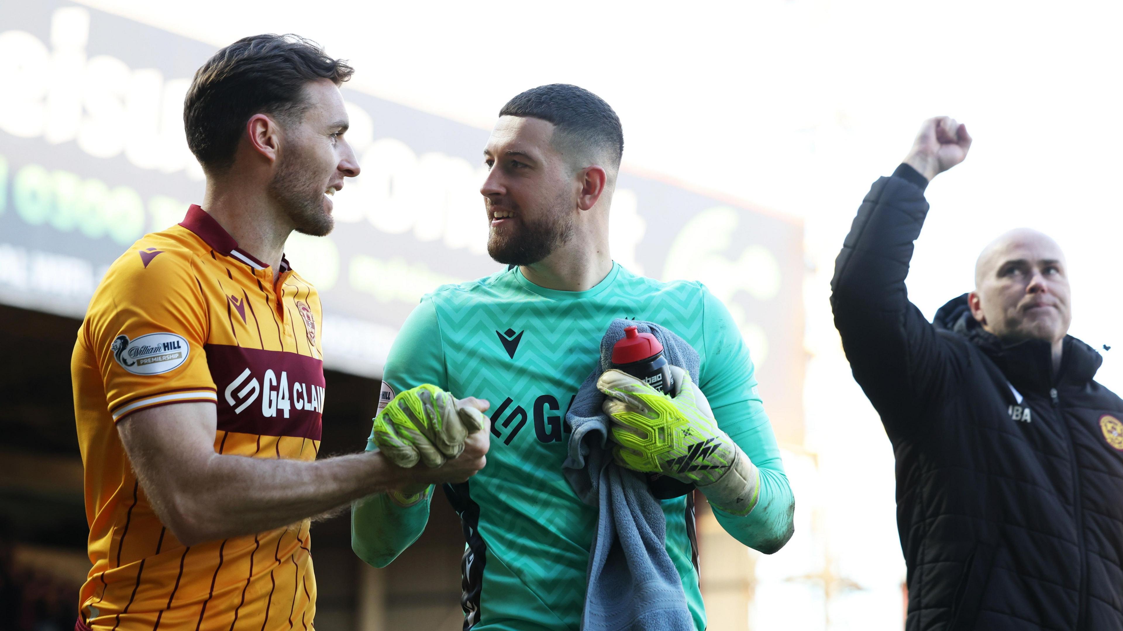 Motherwell defender Stephen O'Donnell, goalkeeper Calum Ward and manager Jens Berthel Askou
