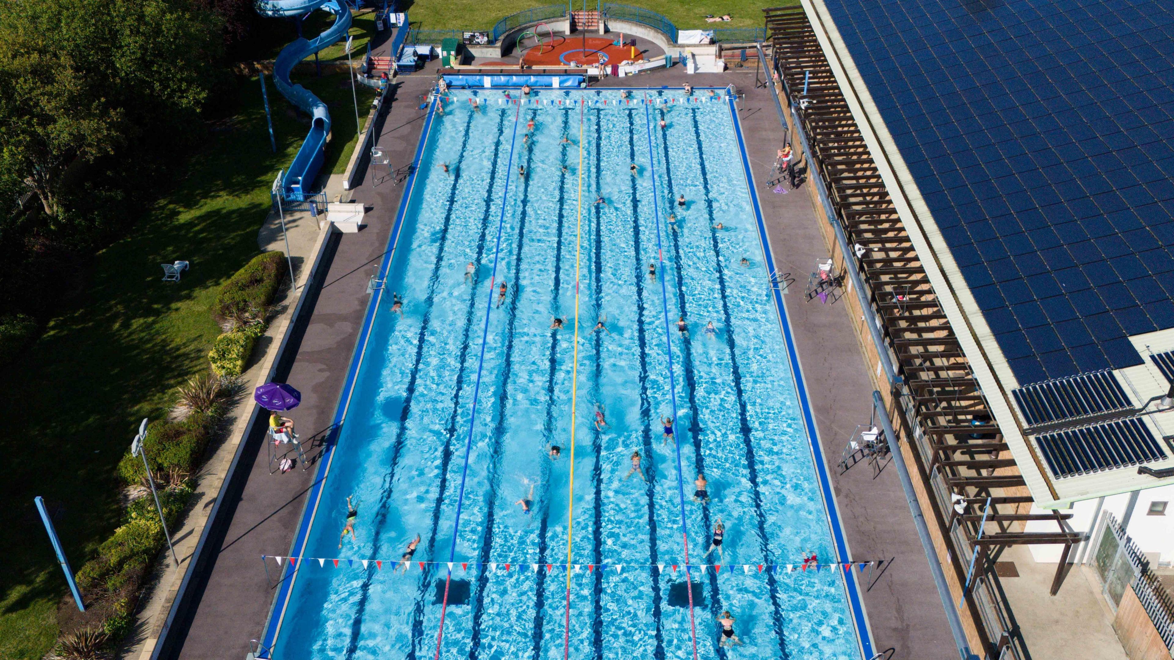 People swim at Banbury Lido at Woodgreen Leisure Centre in Oxfordshire.