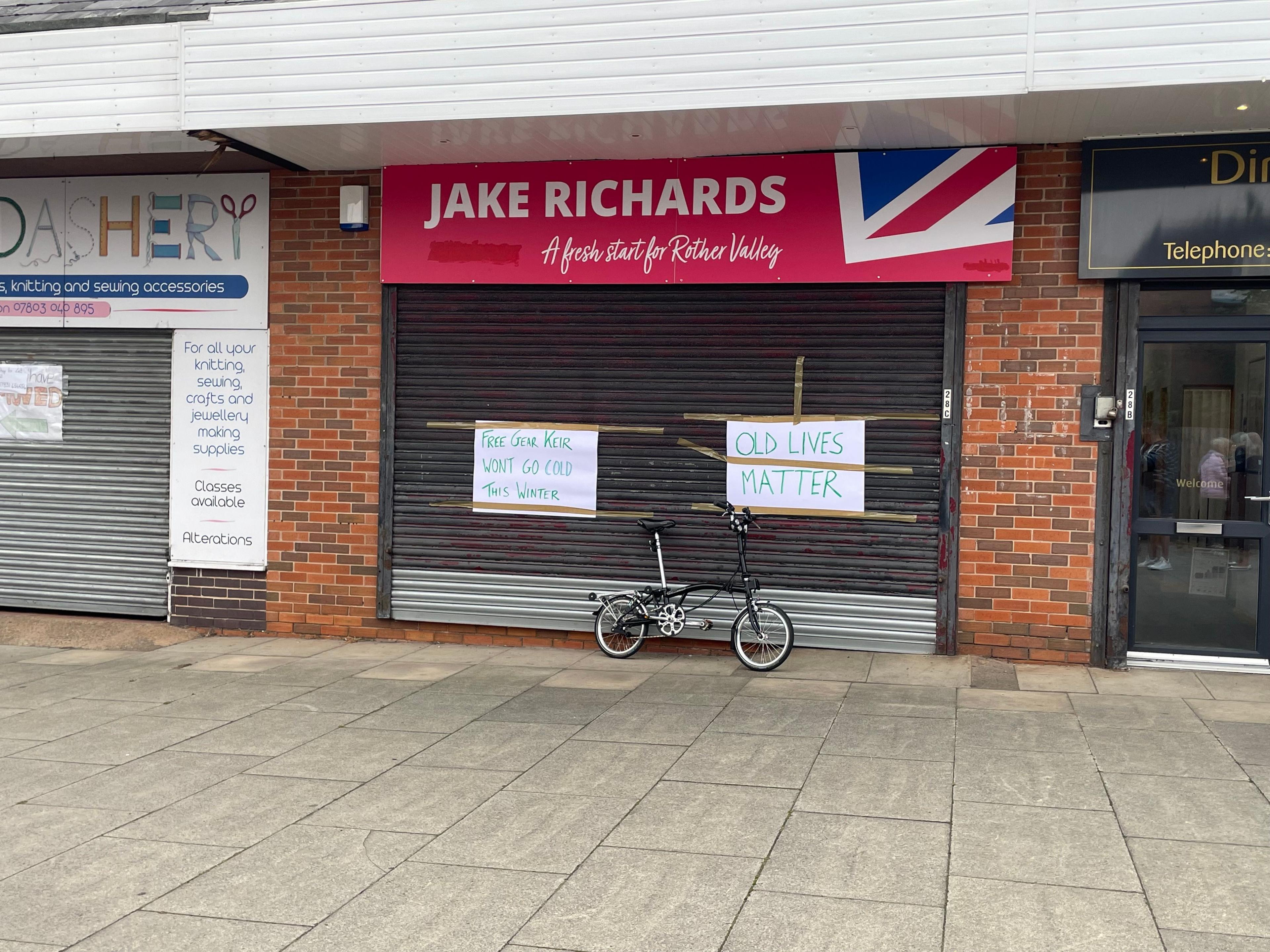 Office with black shutters pulled down