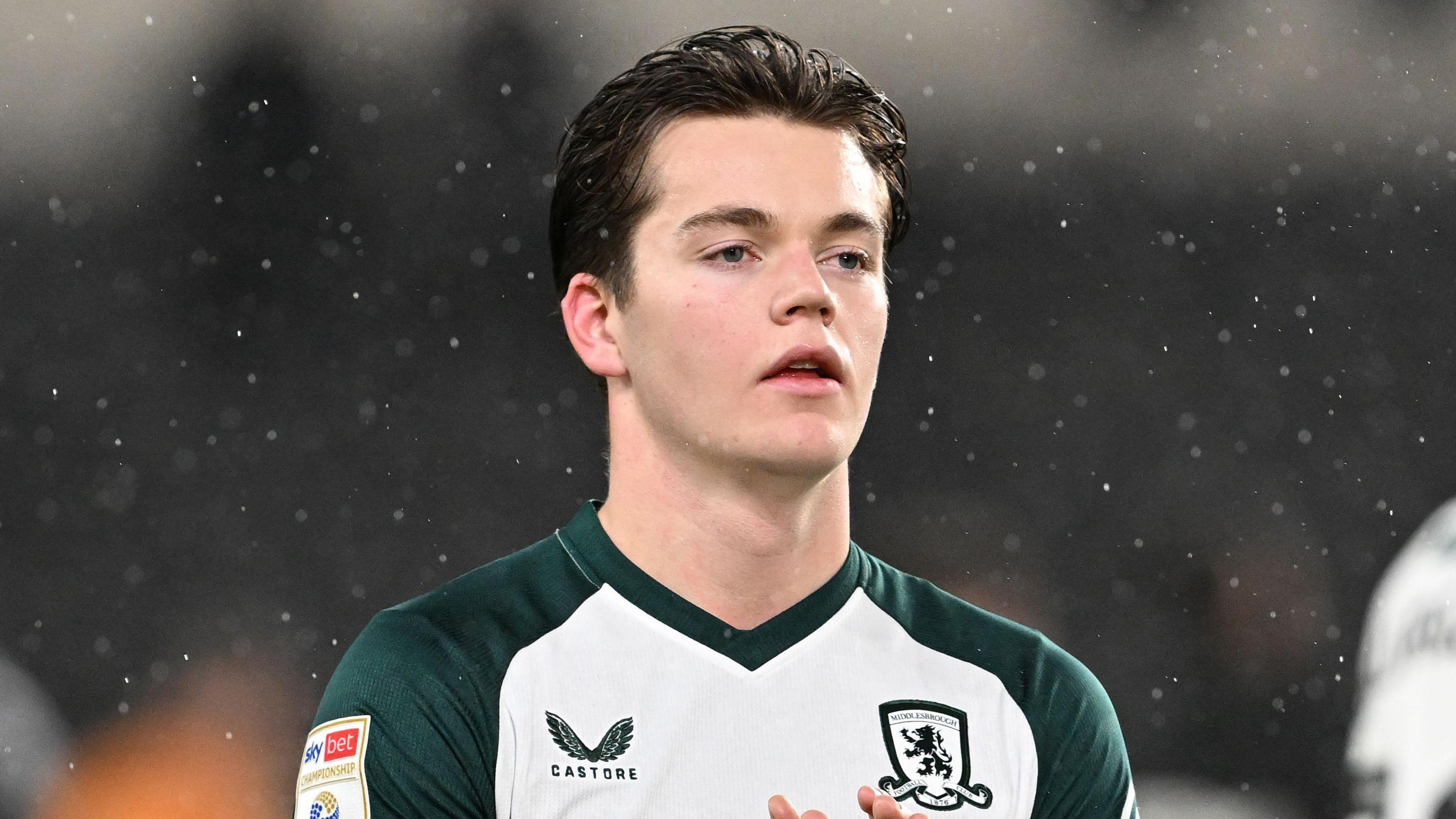 Young Norwegian footballer Sverre Nypan in action on the pitch, wearing Middlesbrough kit during a match.