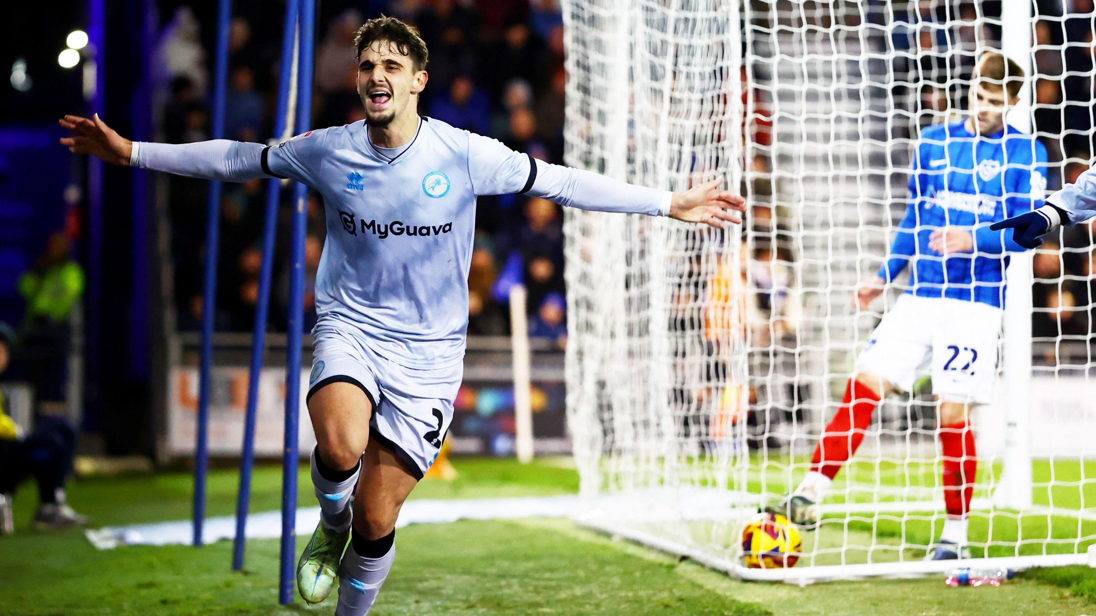 Mihailo Ivanovic of Millwall celebrates scoring at Fratton Park