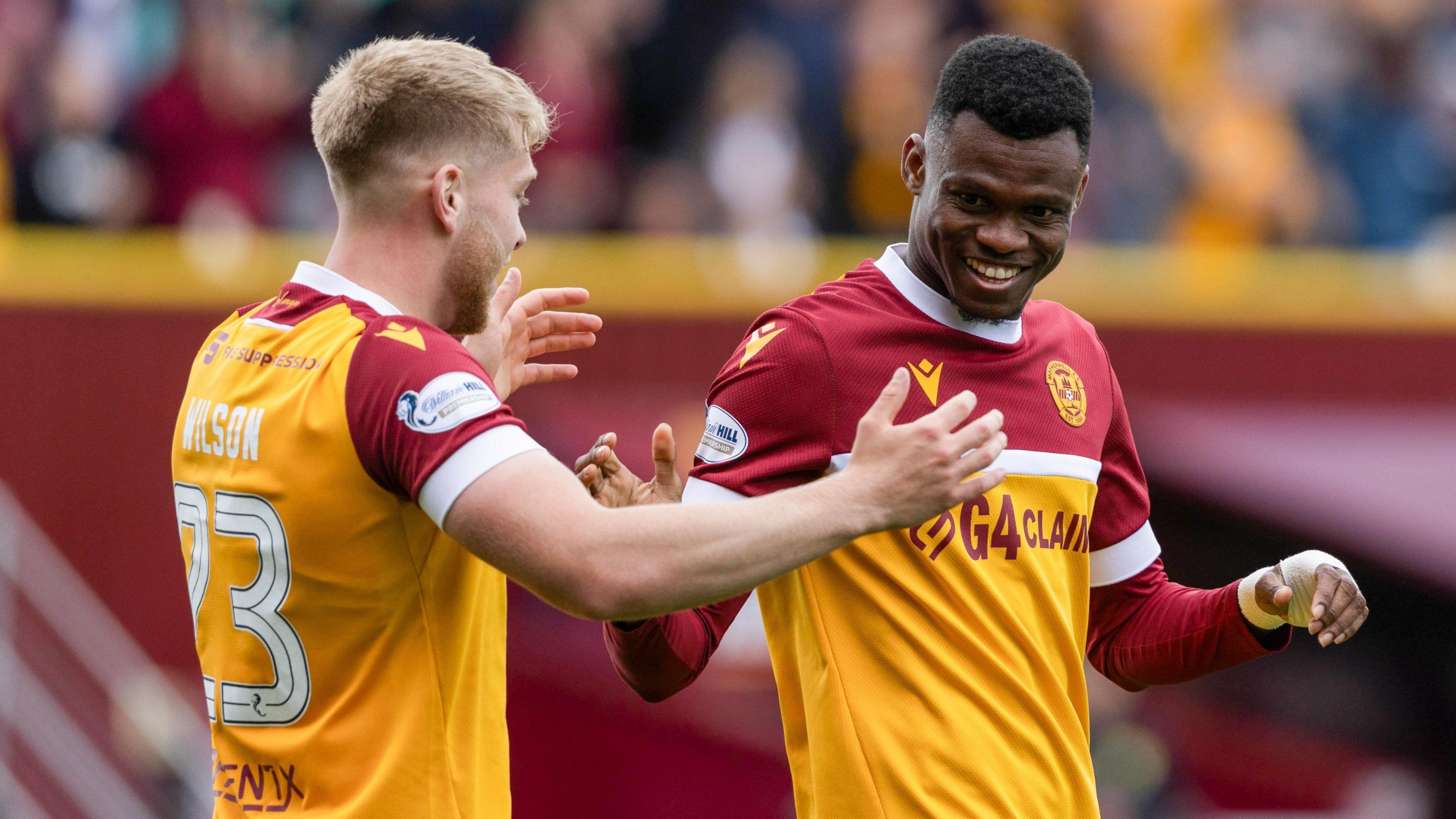 Moses Ebiye, right, celebrates