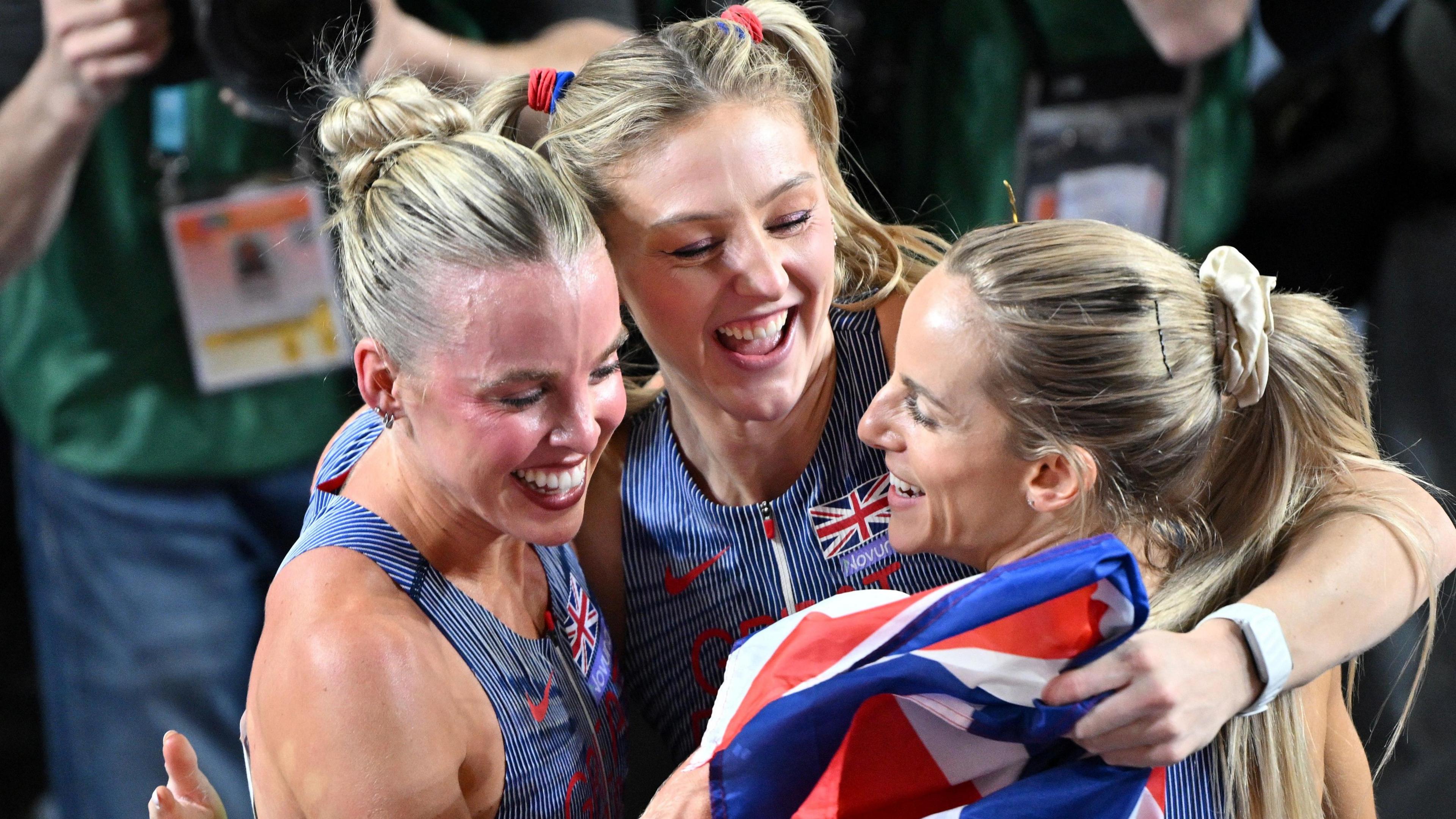 Keeley Hodgkinson (left), Molly Caudery (centre) and Georgia Hunter-Bell embrace after all winning World Indoor Championships gold medals