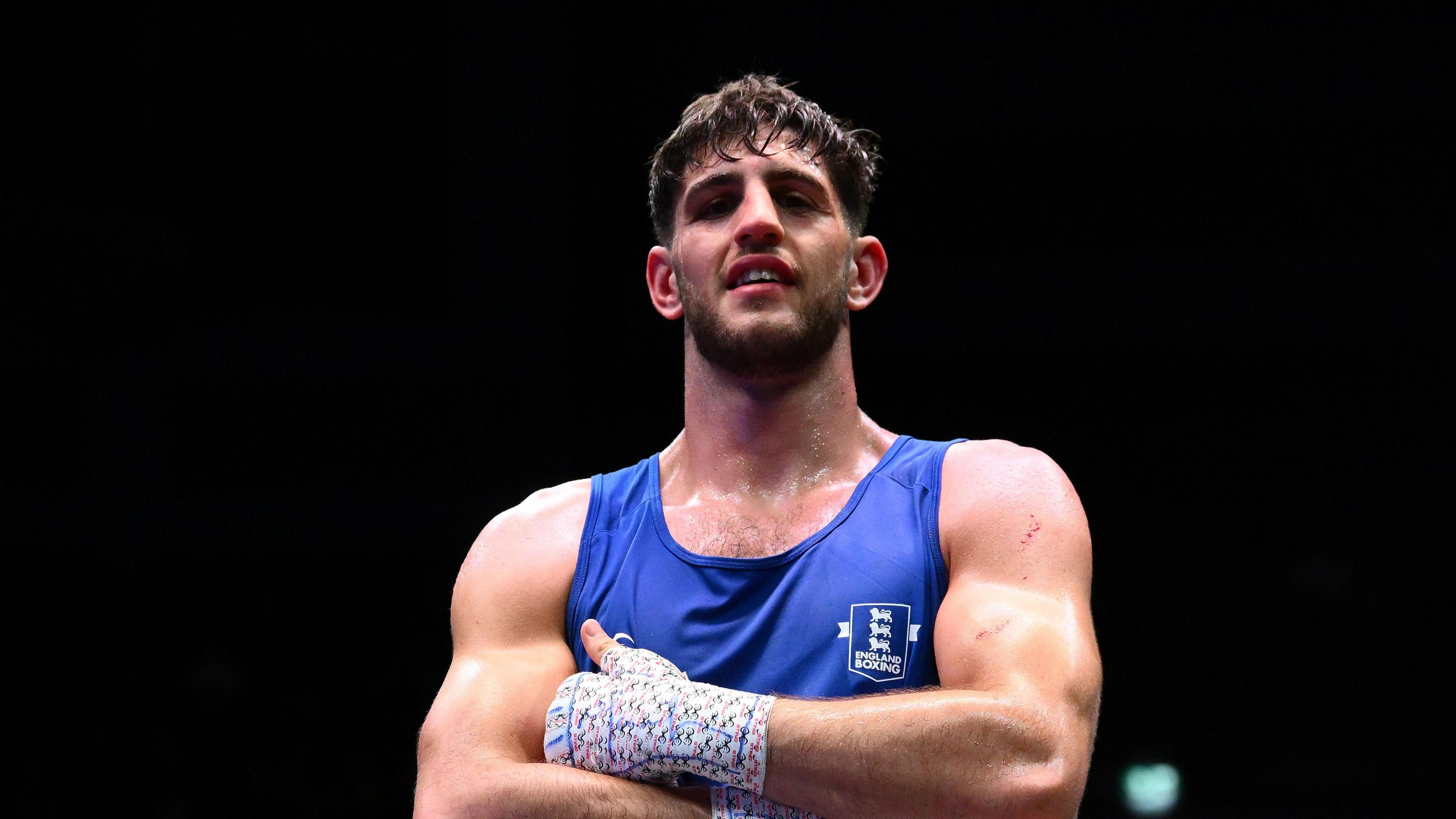 Teagn Stott celebrates beating Danylo Zhasan at the World Boxing Championships