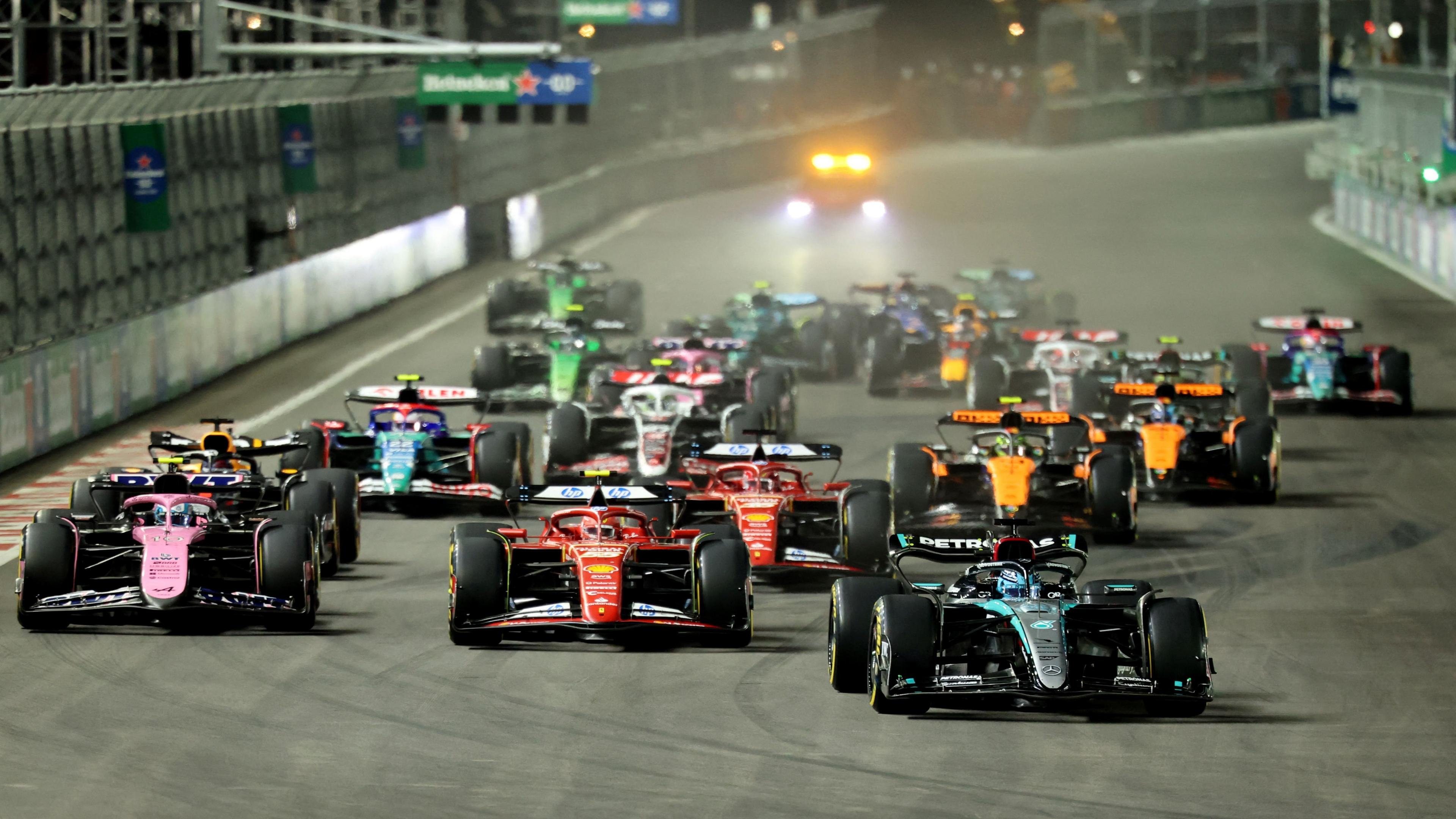 George Russell leads the Ferraris and the rest of the field at the start of the Las Vegas Grand Prix