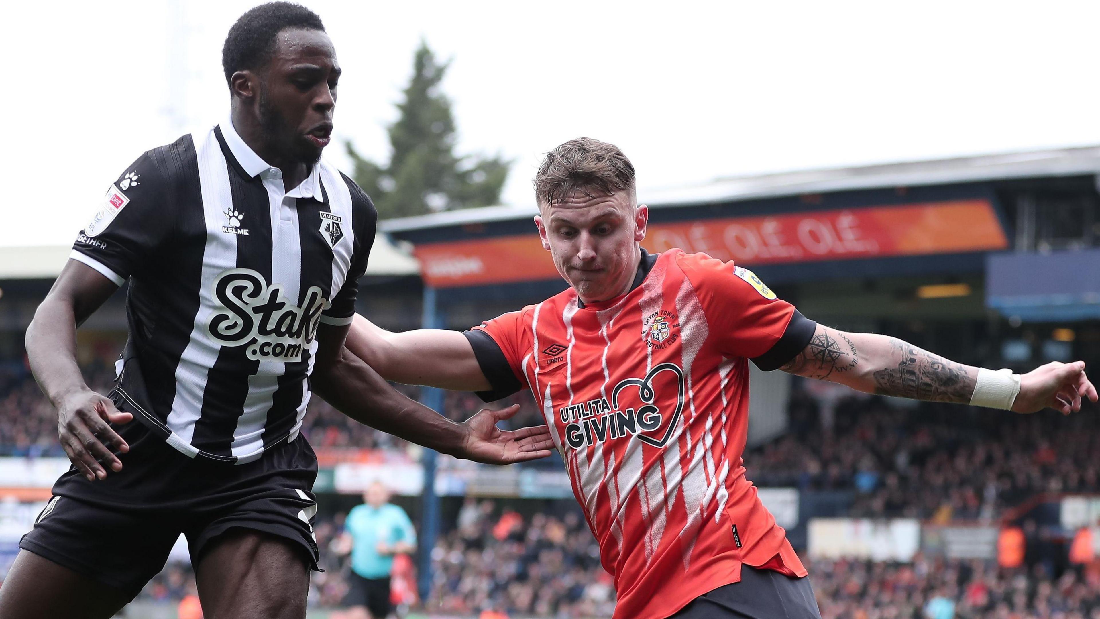 Jeremy Ngakia of Watford and Alfie Doughty of Luton Town in action at Kenilworth Road in April 2023