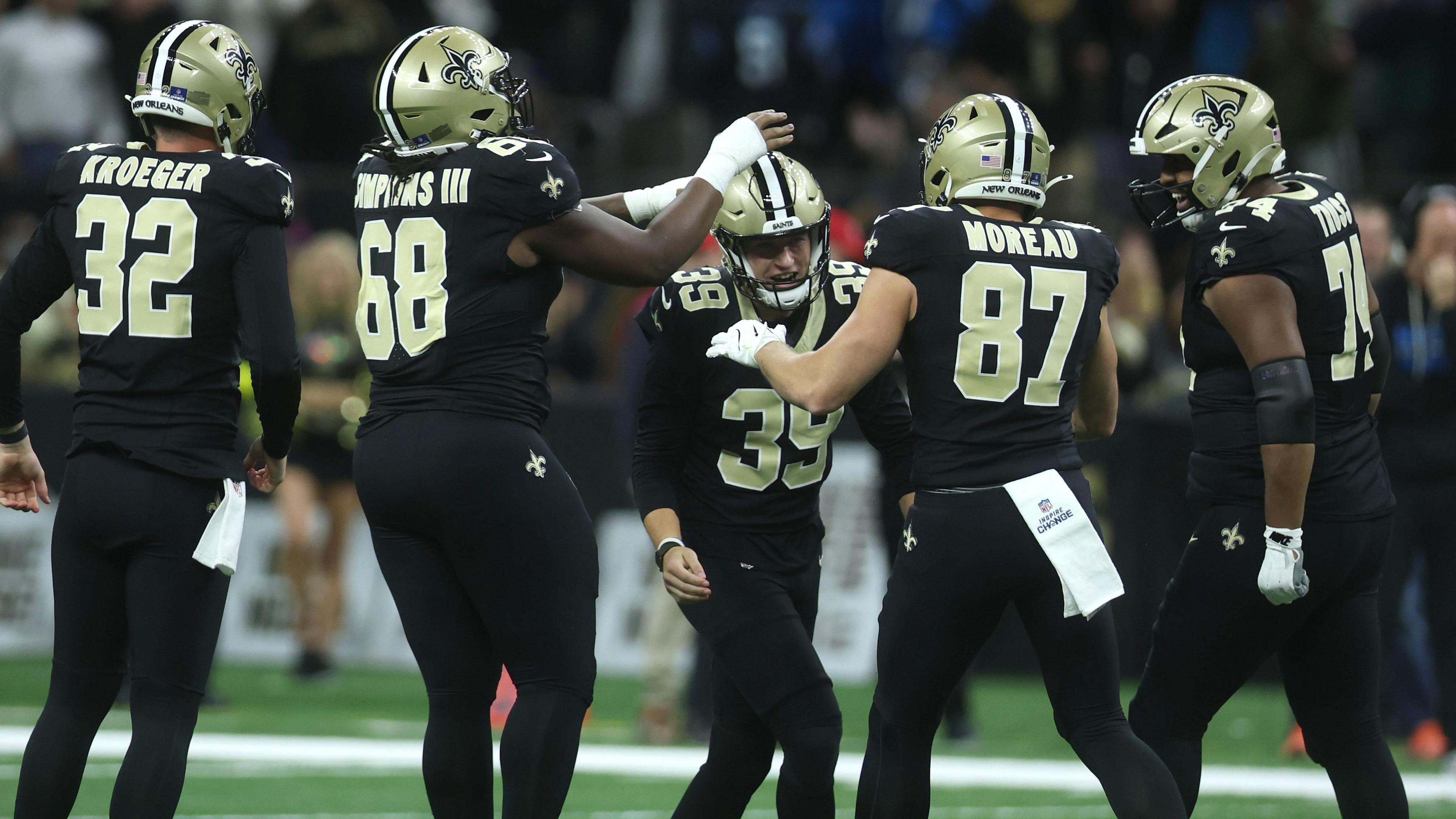 Charlie Smyth is mobbed by his team-mates