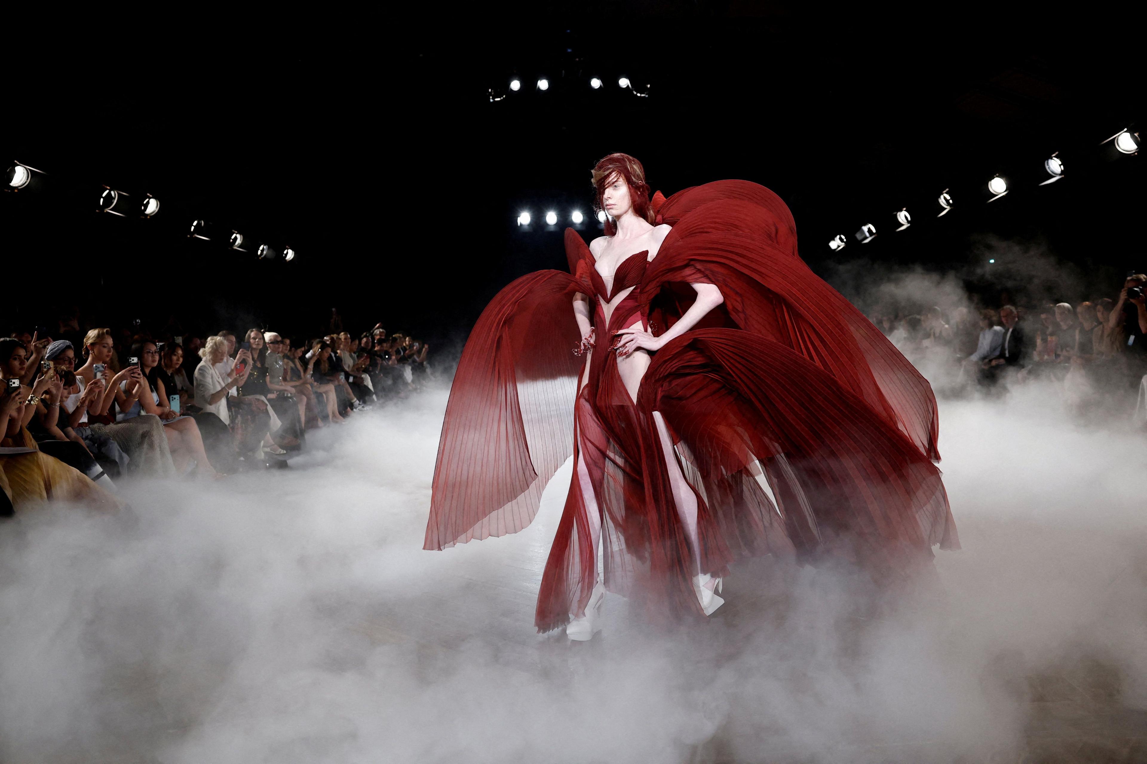 A model presents a creation by designer Iris van Herpen as part of her Haute Couture Fall/Winter 2026-2027 collection show in Paris, France, July 6, 2026.