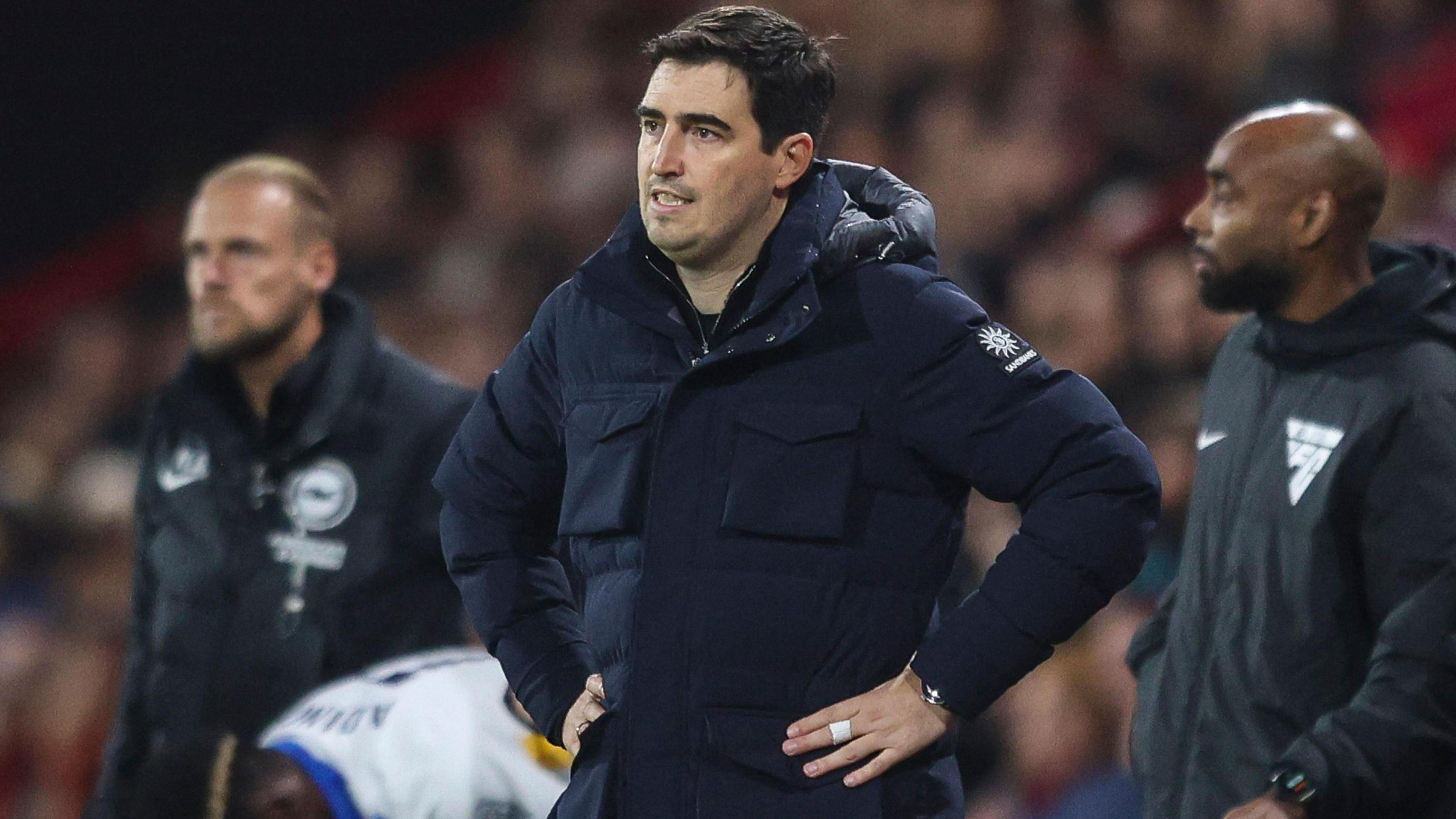 Andoni Iraola looks on with hands of hips