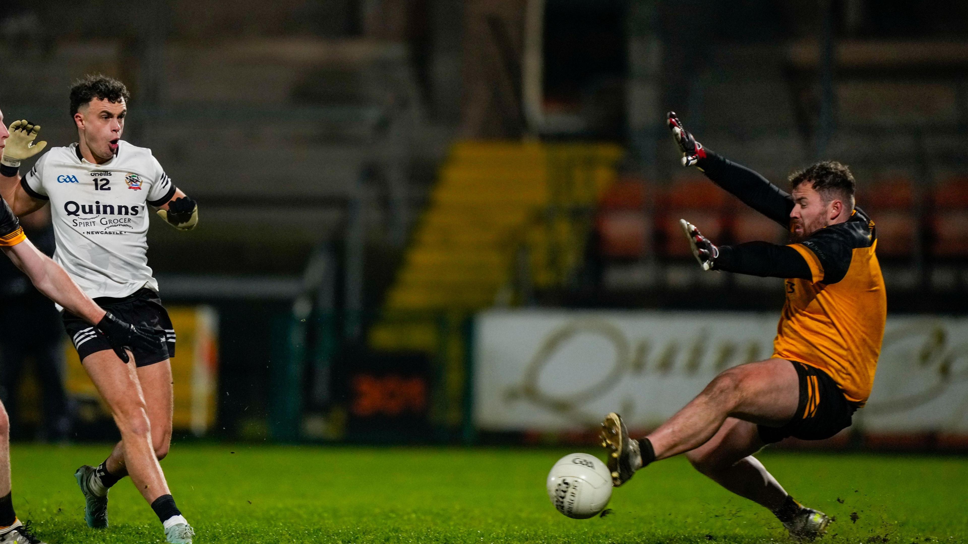 Shealan Johnston scores Kilcoo's third goal in their victory over Erne Gaels shooting past Brian Ryder 