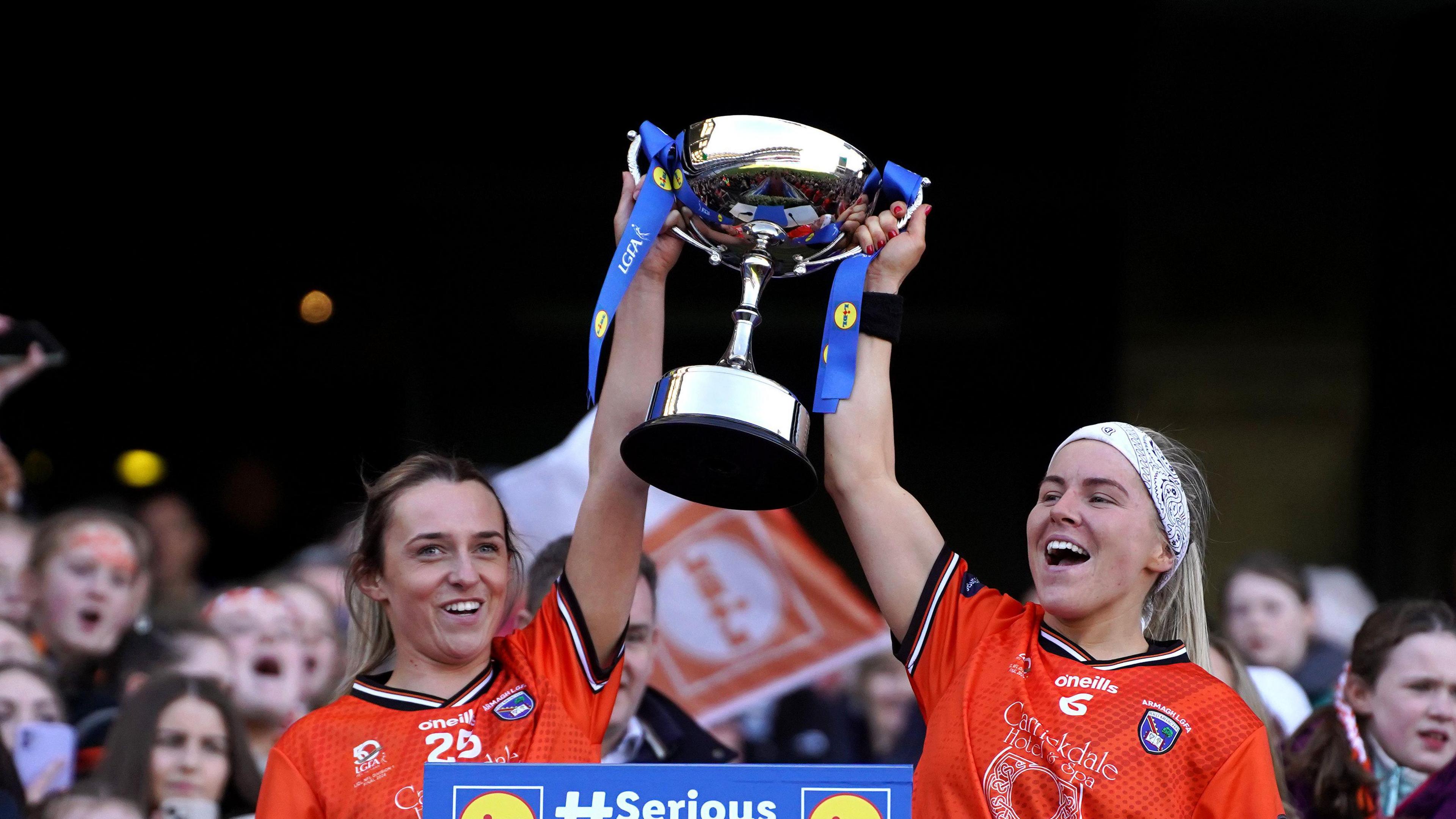 Armagh's Eve Lavery and Lauren McConville lifts the National Football League Division 1 trophy at Croke Park.