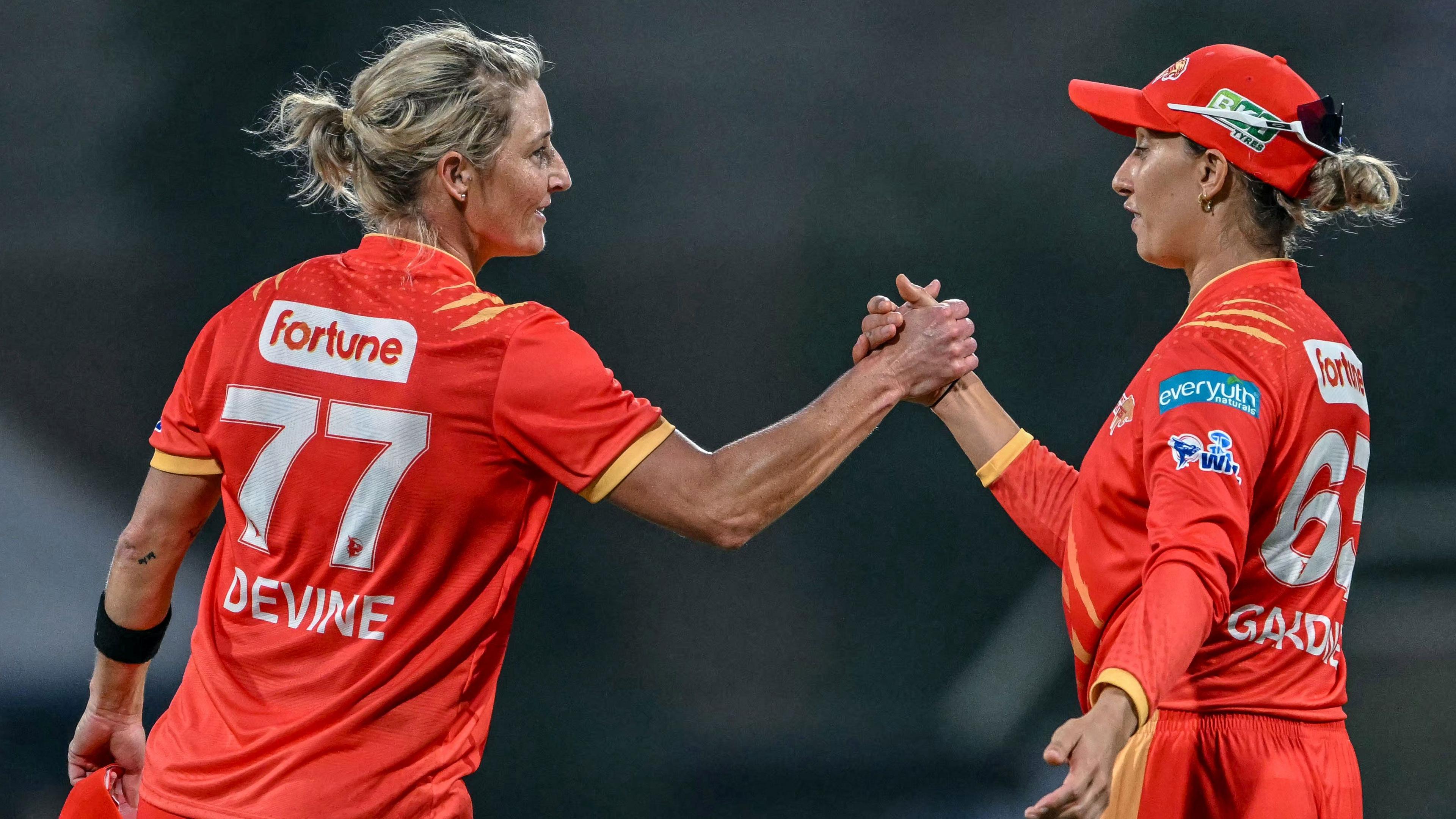 Sophie Devine and Ash Gardner clap hands