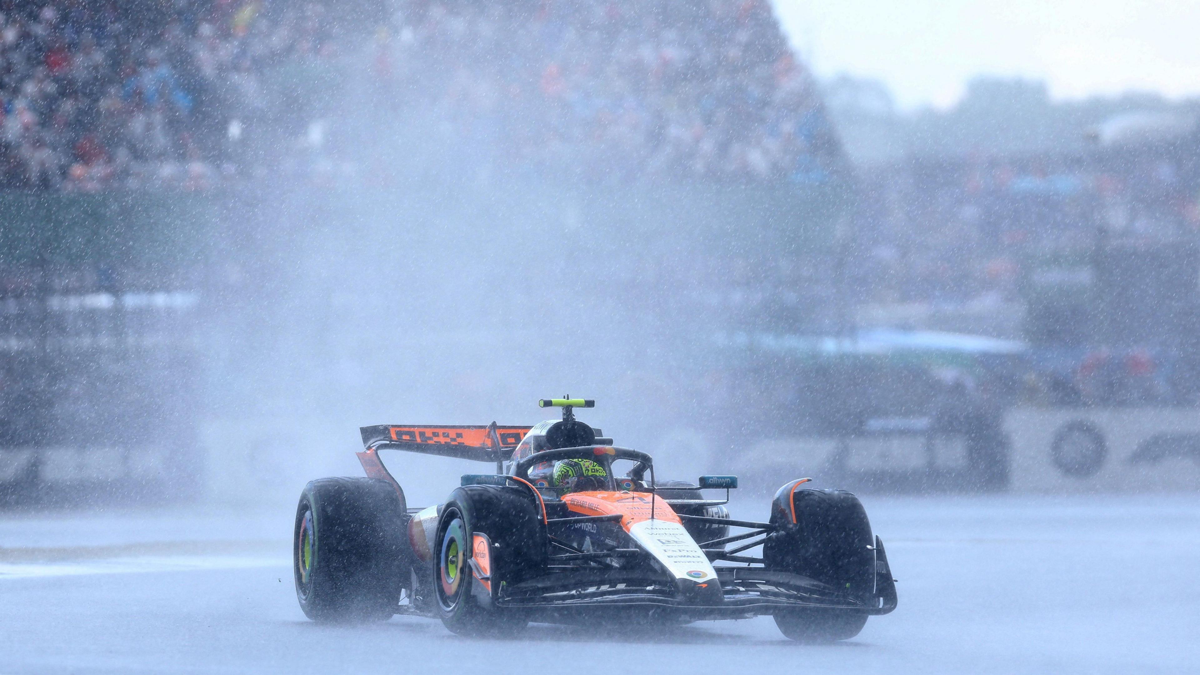 Lando Norris' McLaren during the British Grand Prix as torrential rain falls