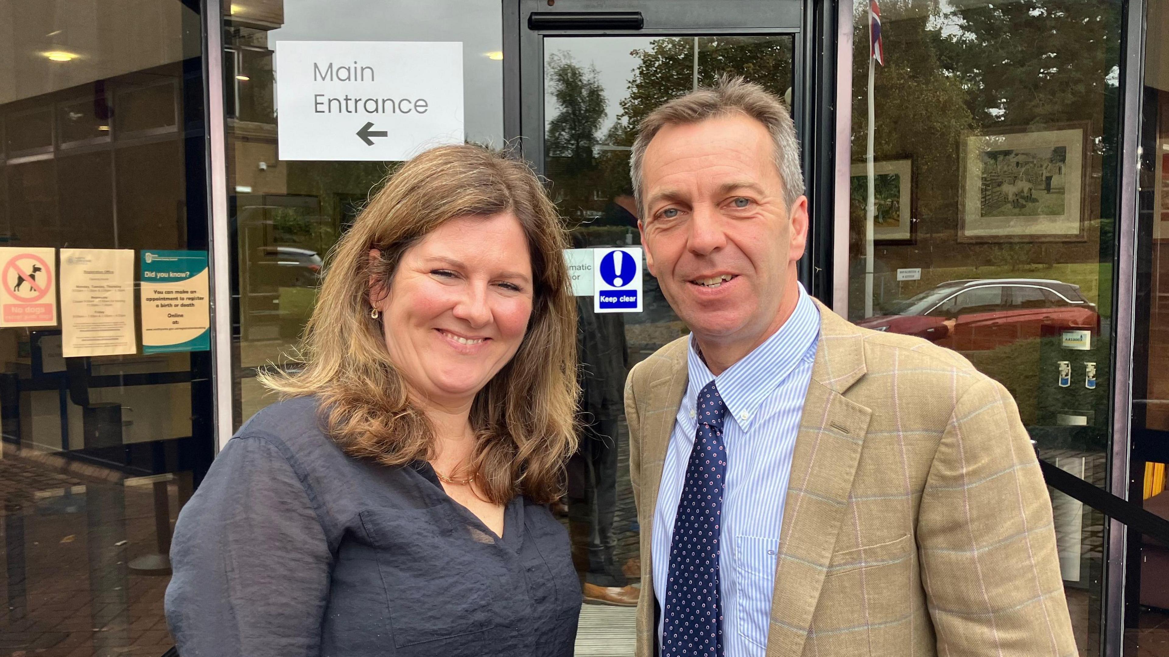 Tenant farmers Emma and Rob Sturdy stand outside the venue for the public inquiry, in Malton.