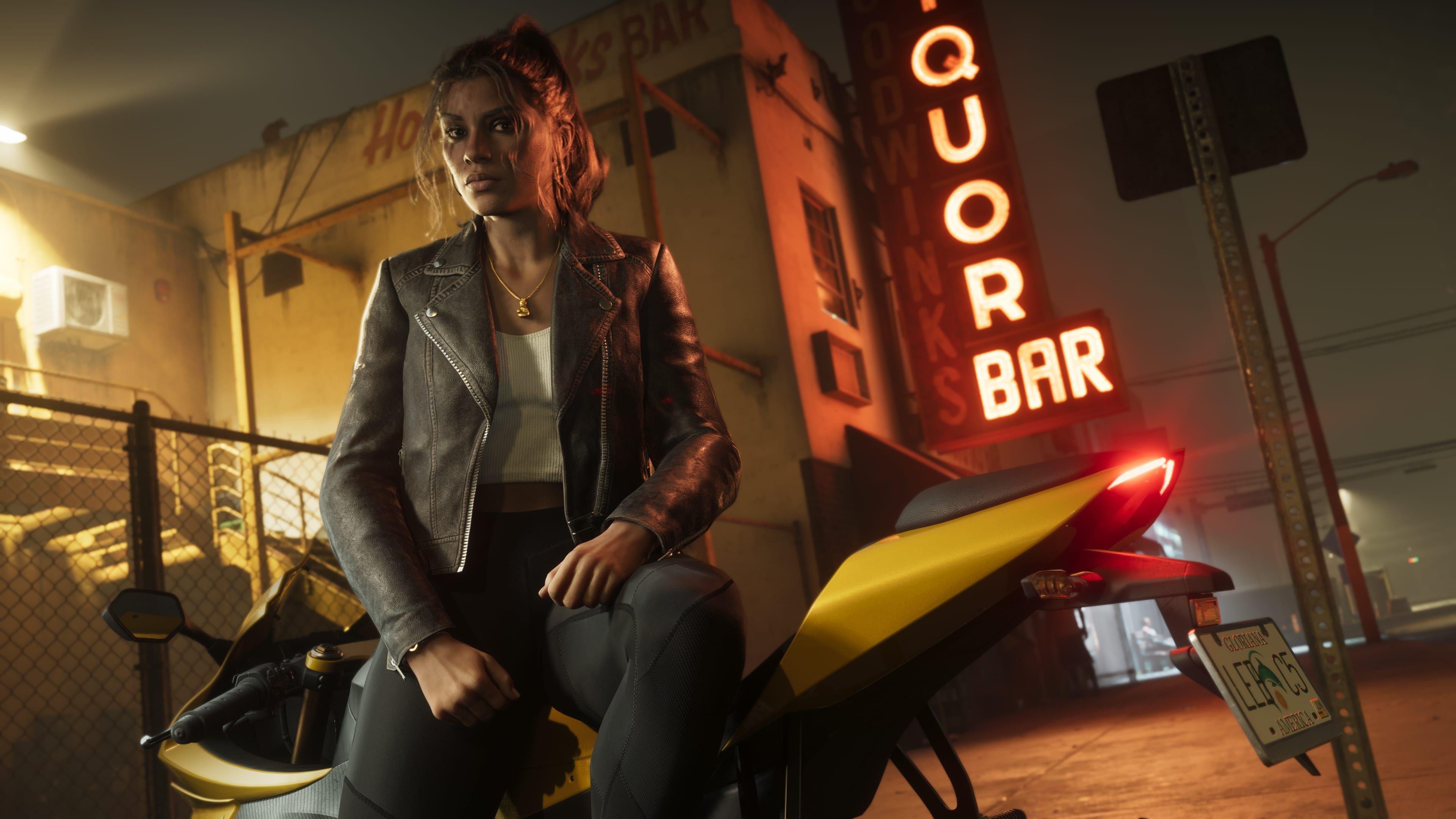 A screenshot from GTA 6 shows Lucia, at night, sitting on a parked yellow motorbike. She has her hair tied back and wears a leather jacket over a white t-shirt. She's next to a wire fence that surrounds a dirty-looking building with a large, red, glowing sign that reads "Liquor Bar" in the background.