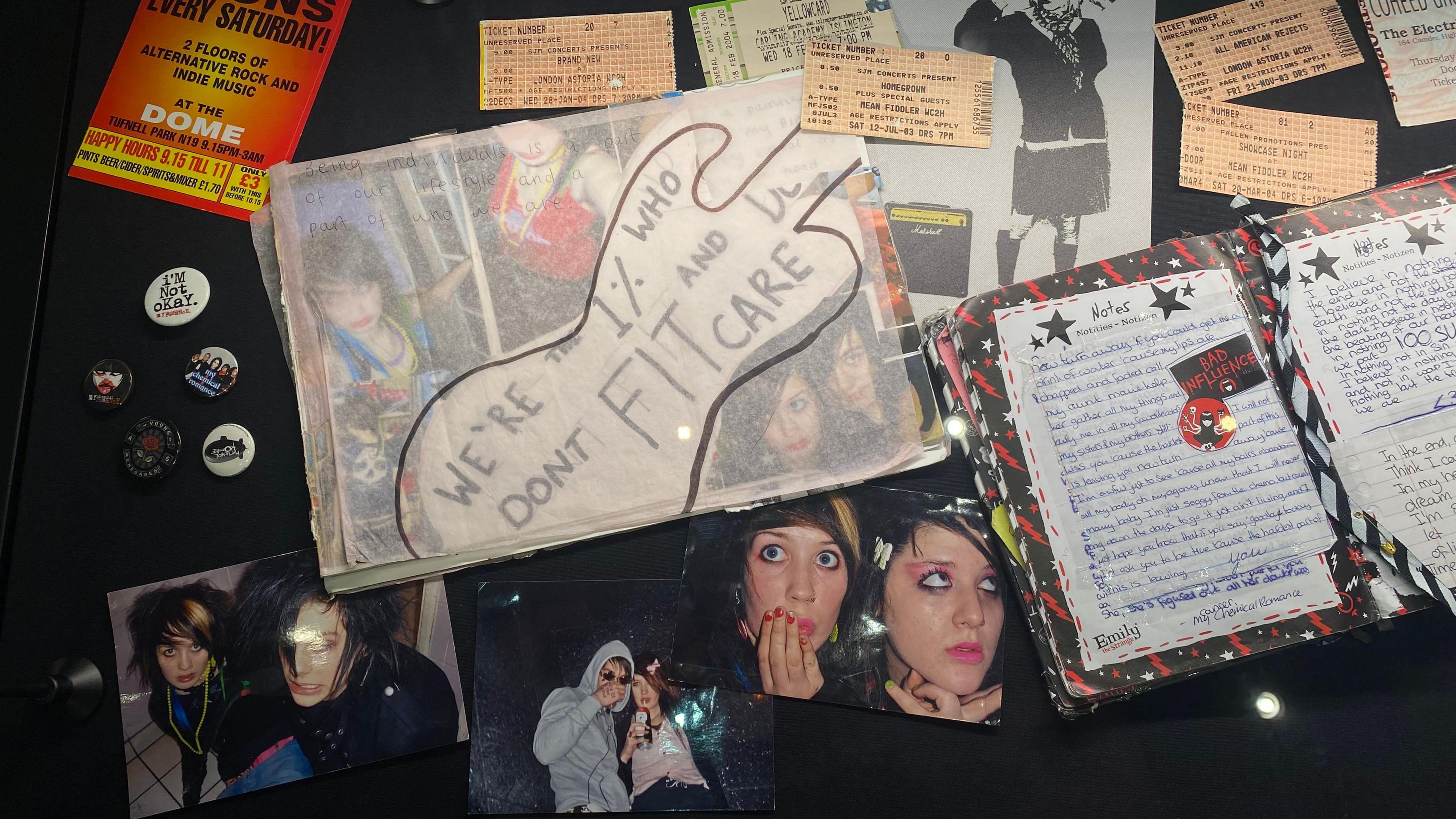 Part of the exhibition that shows images of emo teenagers alongside diary entries and concert tickets. An art piece in the middle says "We're the 1% who don't fit and care." 