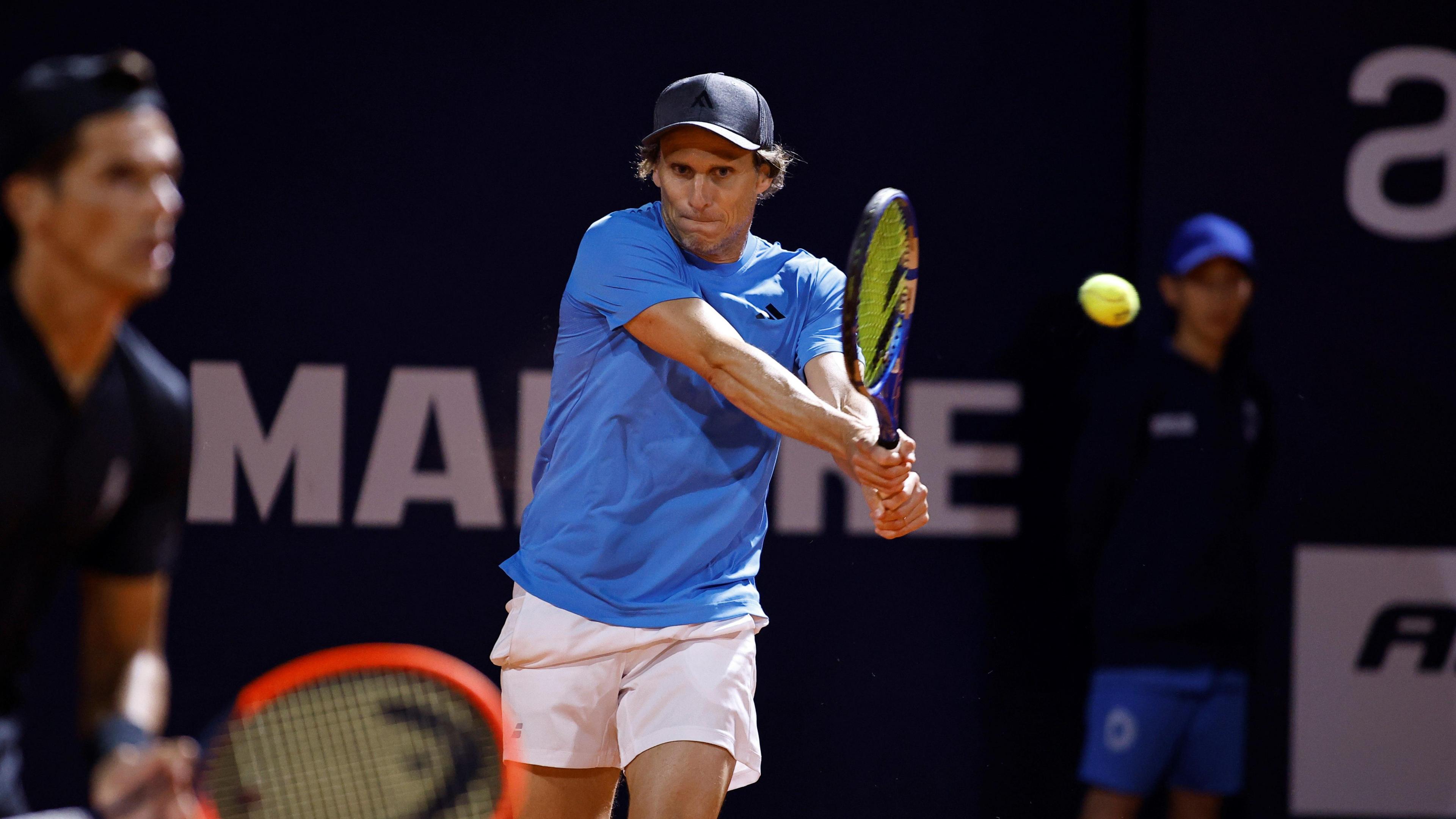 Diego Forlan plays a backhand