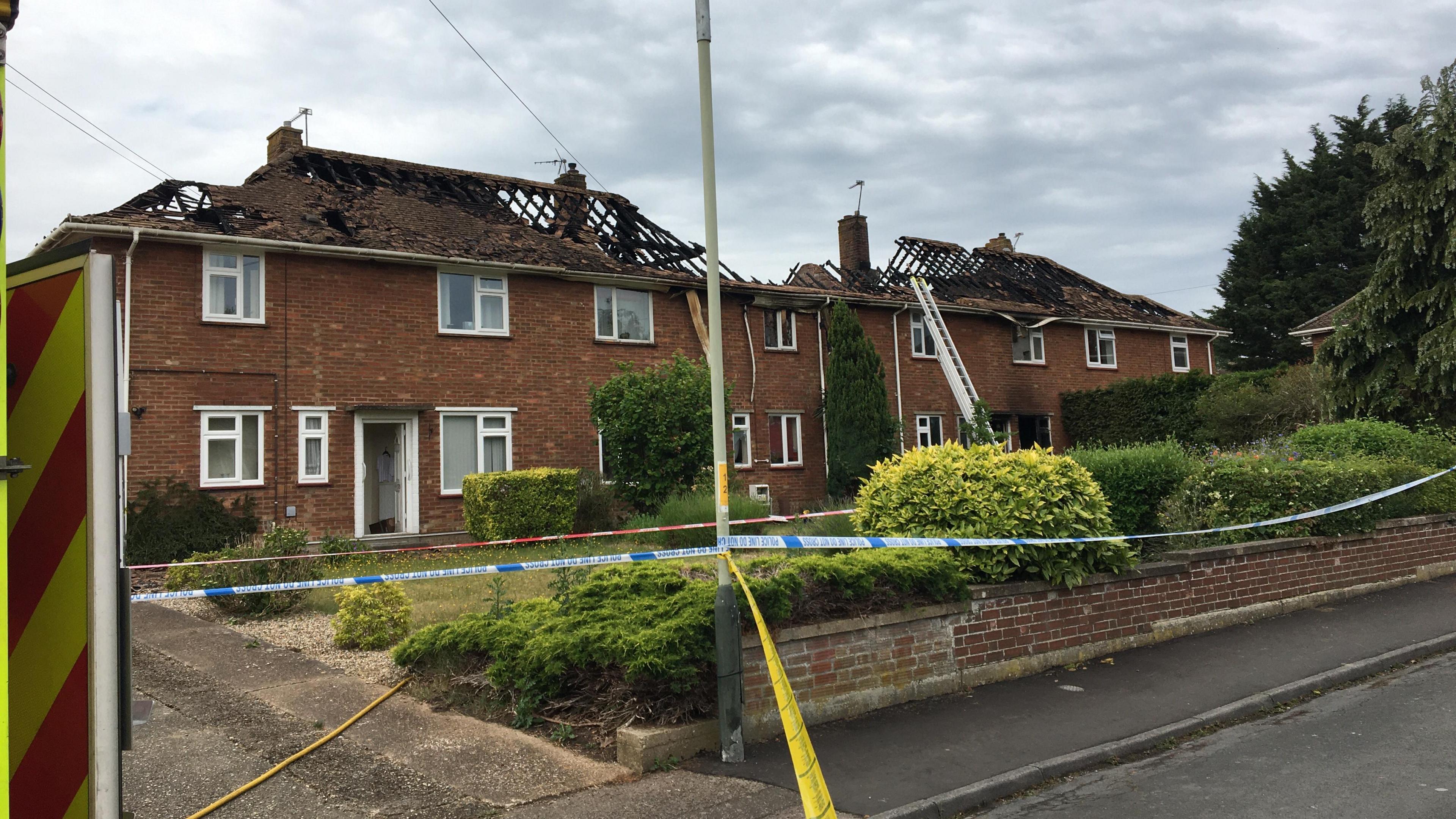 The four terraced houses damaged in the fire on Hall Road