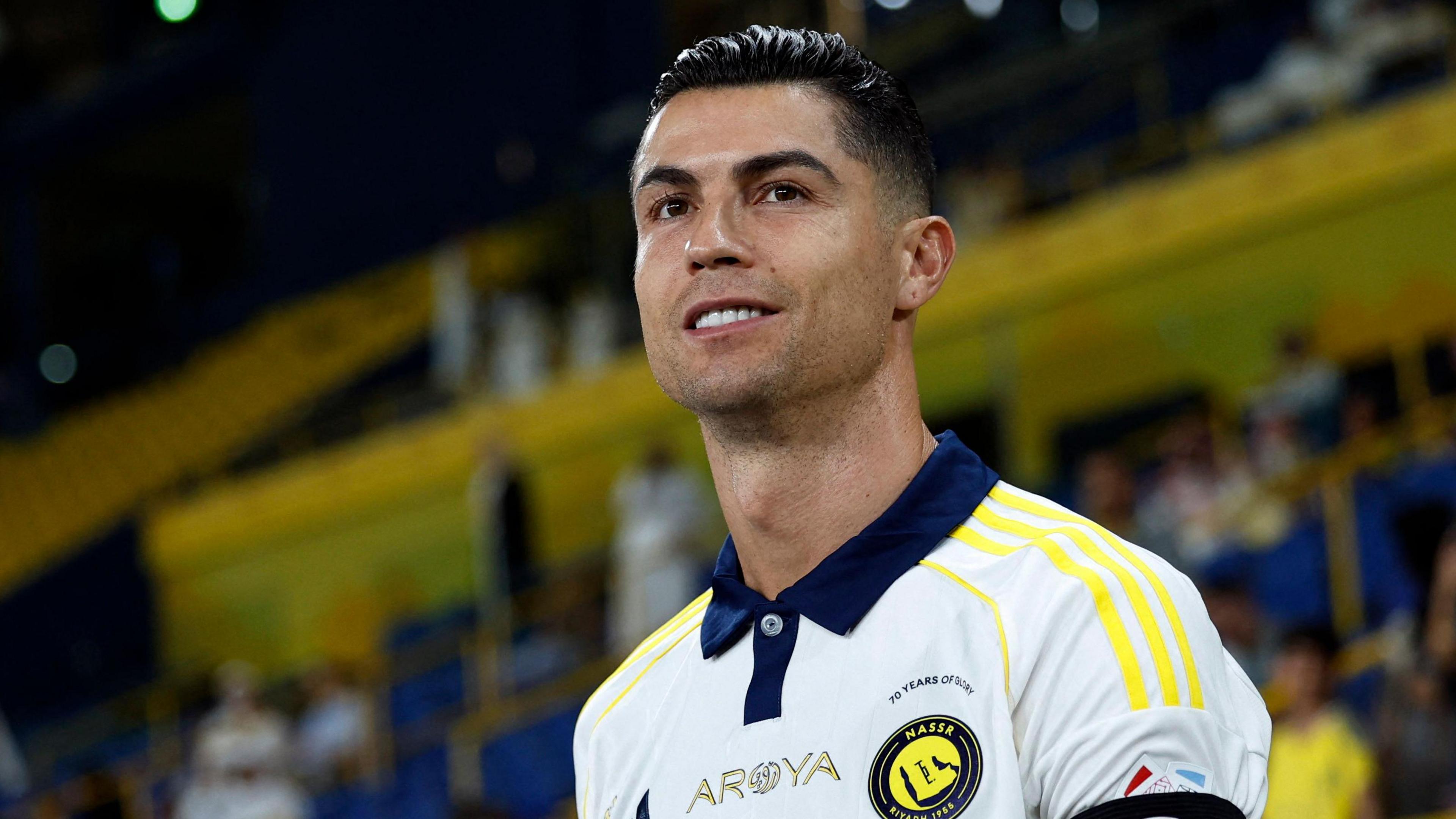 Al-Nassr captain Cristiano Ronaldo walks on to the field for his team's game against Al-Khaleej on 21 May 2025
