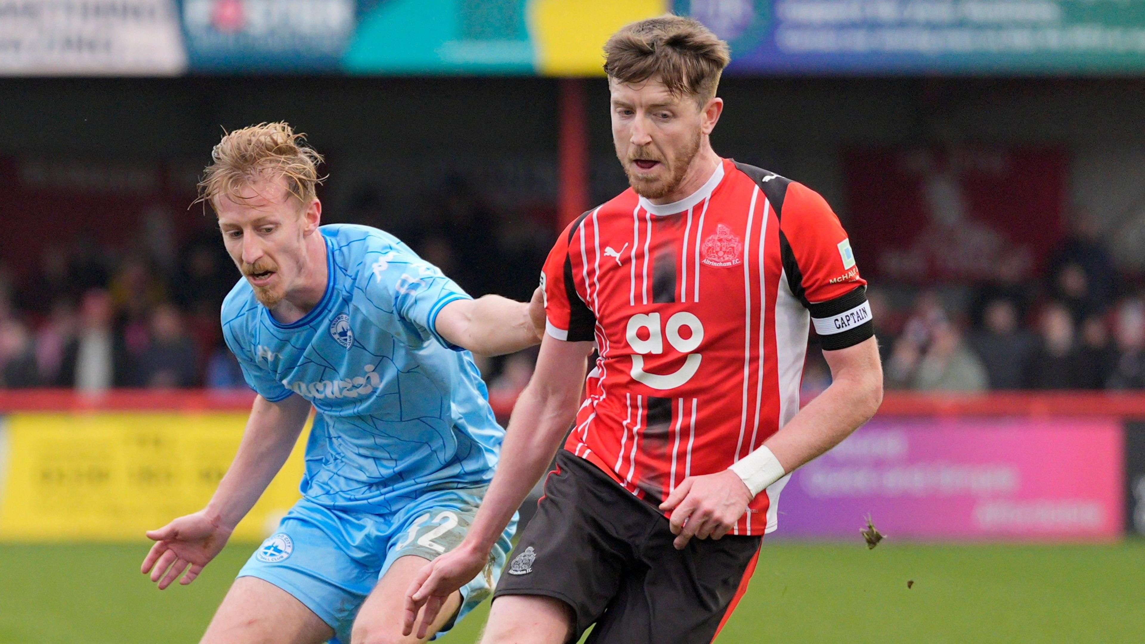Altrincham's Tom Crawford (R)