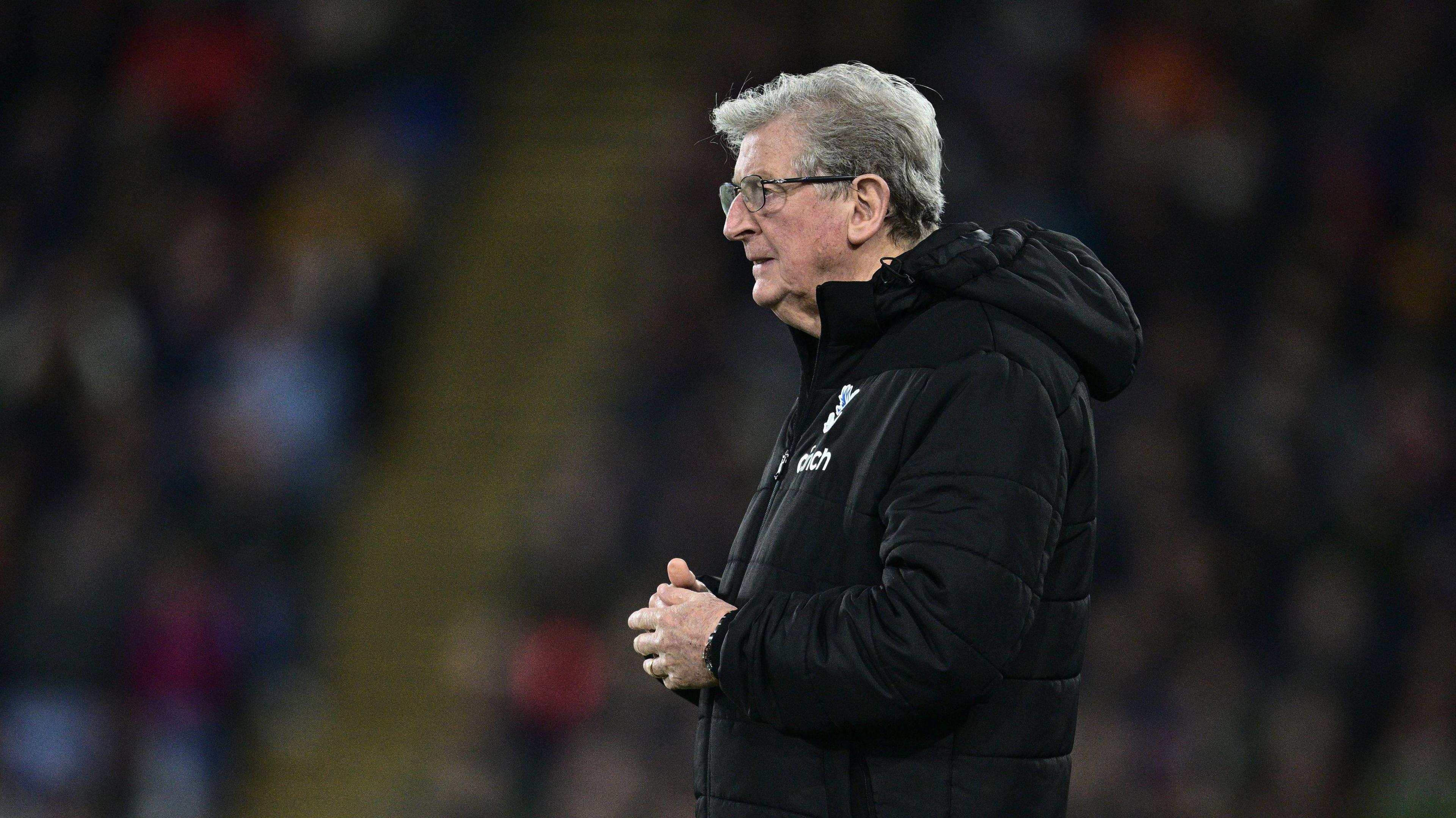 Roy Hodgson is wearing a agelong achromatic overgarment arsenic he watches a crippled while head of Crystal Palace successful 2024.