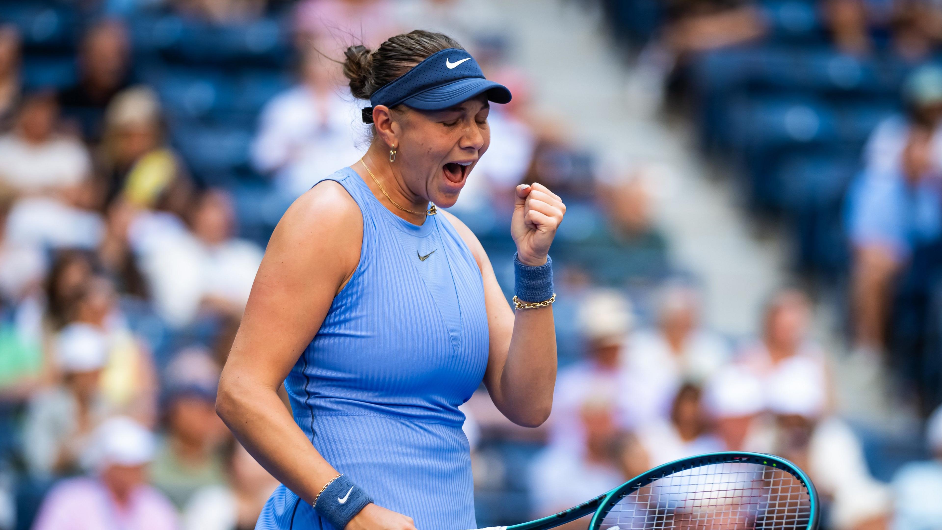 Amanda Anisimova celebrates beating Iga Swiatek at US Open quarter-final on Arthur Ashe stadium, New York