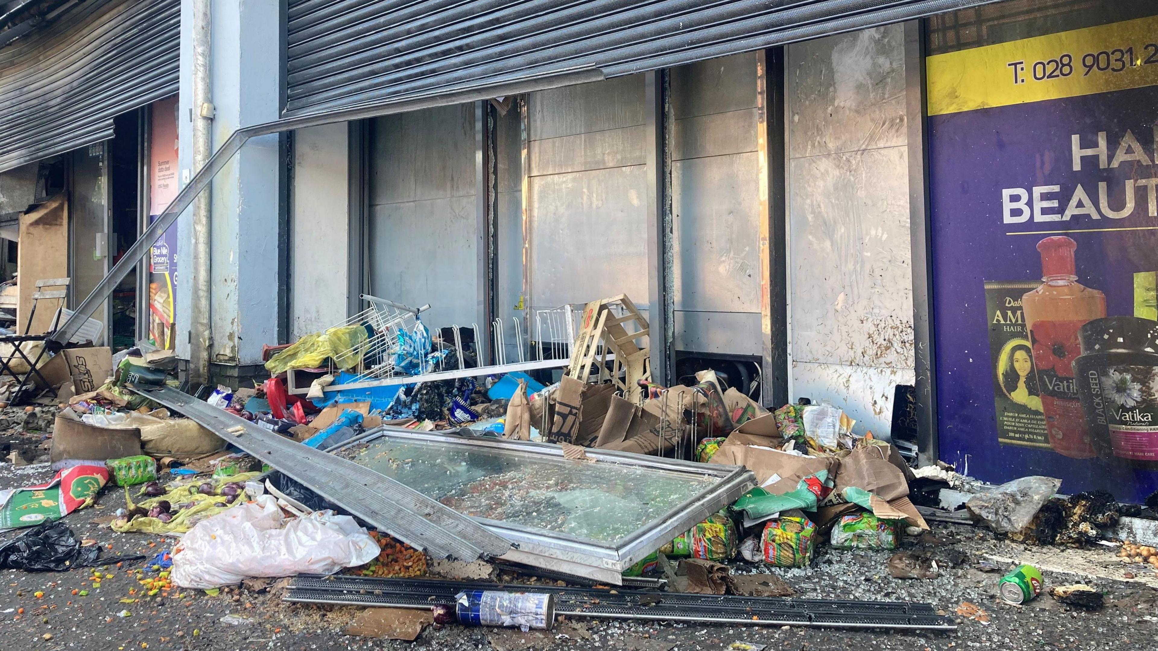 Sham Supermarket on Donegall Road in Belfast. The shop was burned during disorder in the area, following an anti-immigration protes