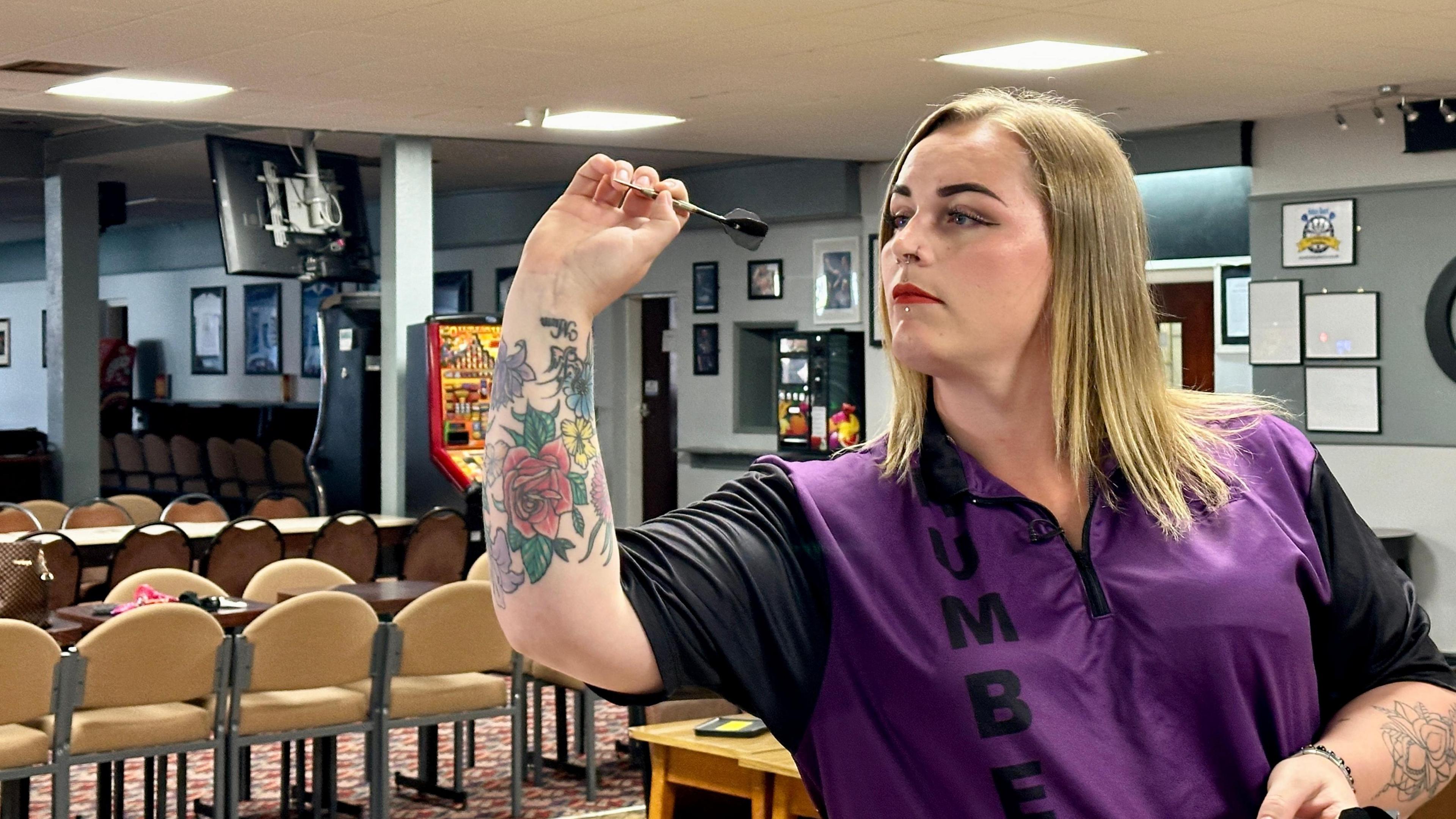 Transgender darts player from Hull shaken by abuse and bans - BBC News