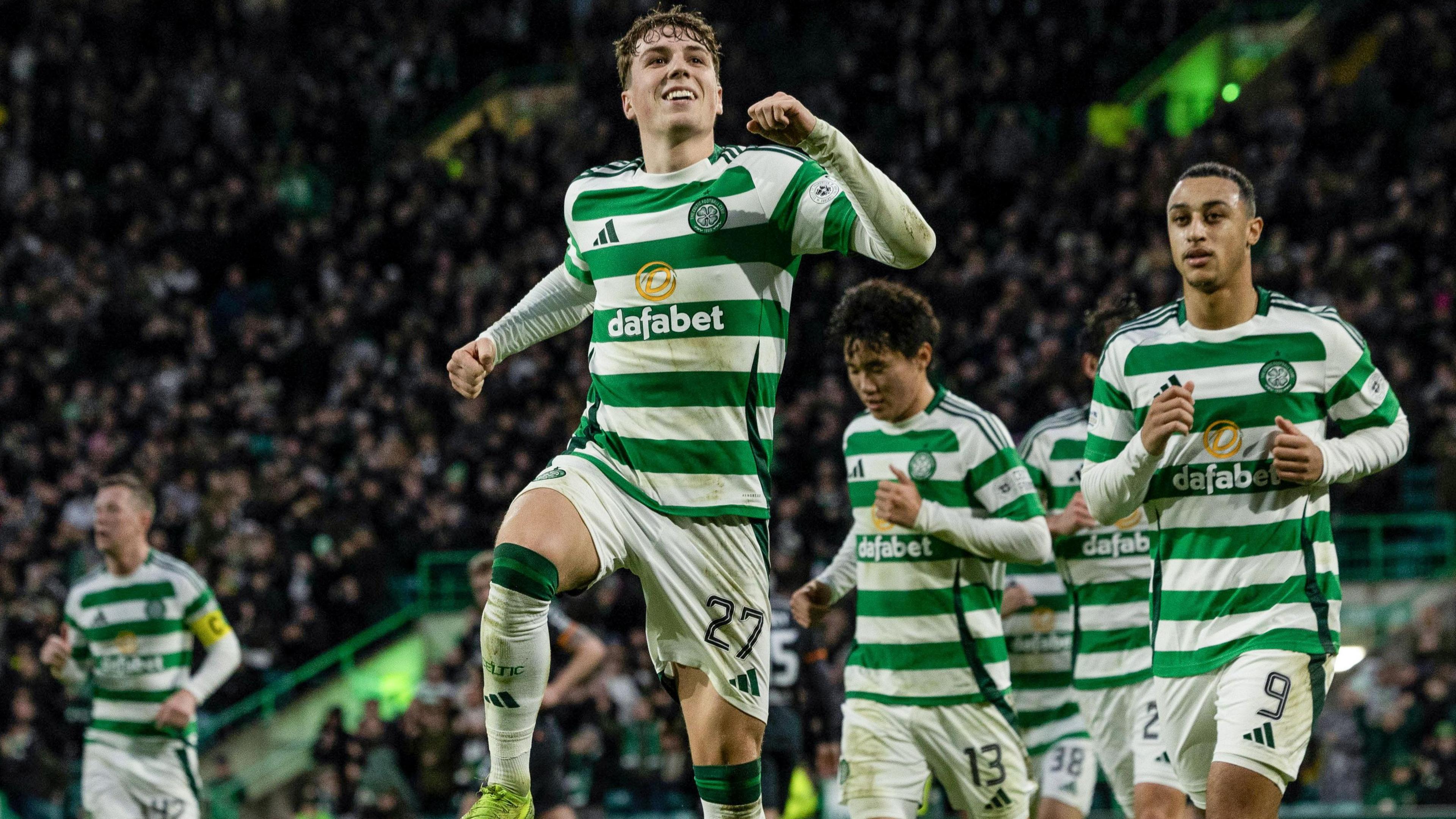 Celtic players celebrate with goalscorer Arne Engels